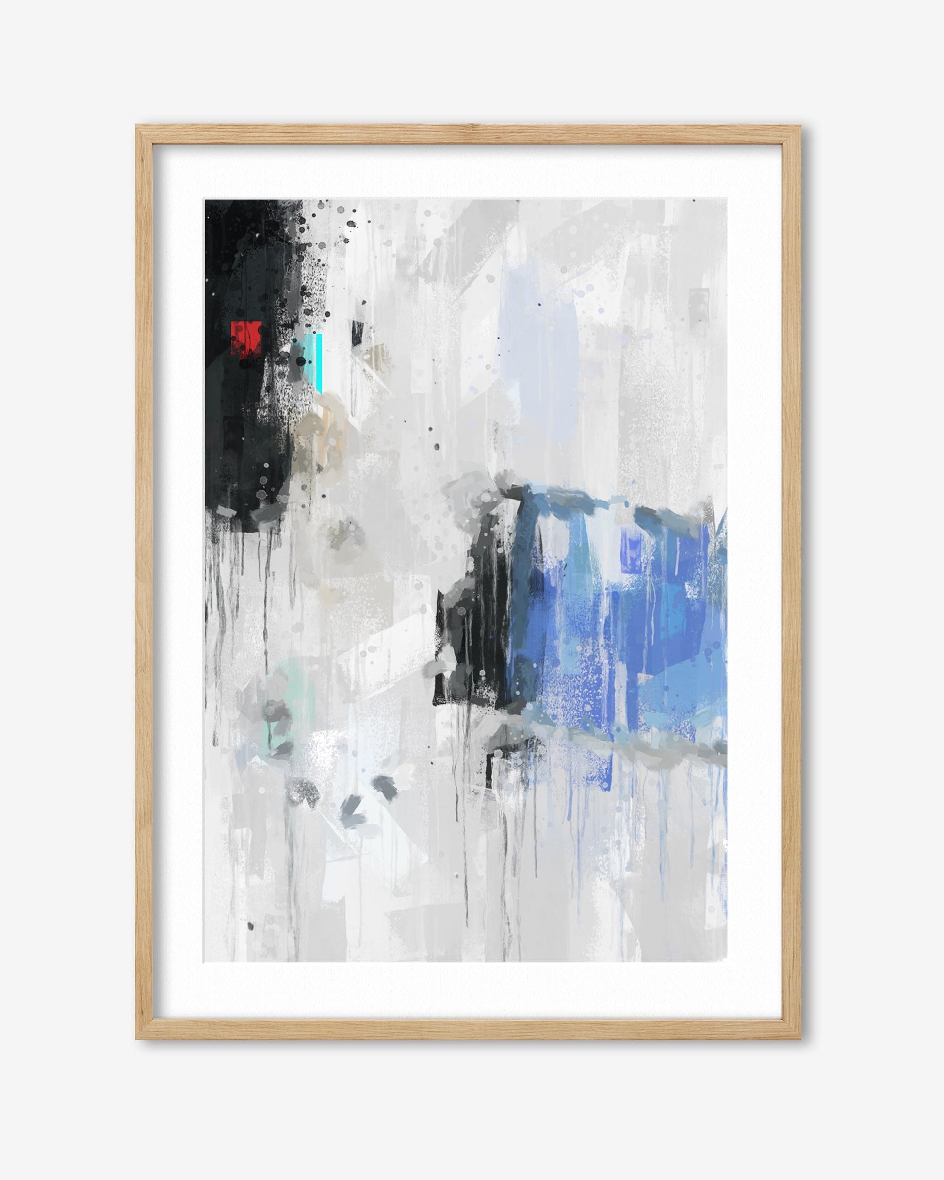 Abstract art print with black, white, and blue colors in a wooden frame on a white background