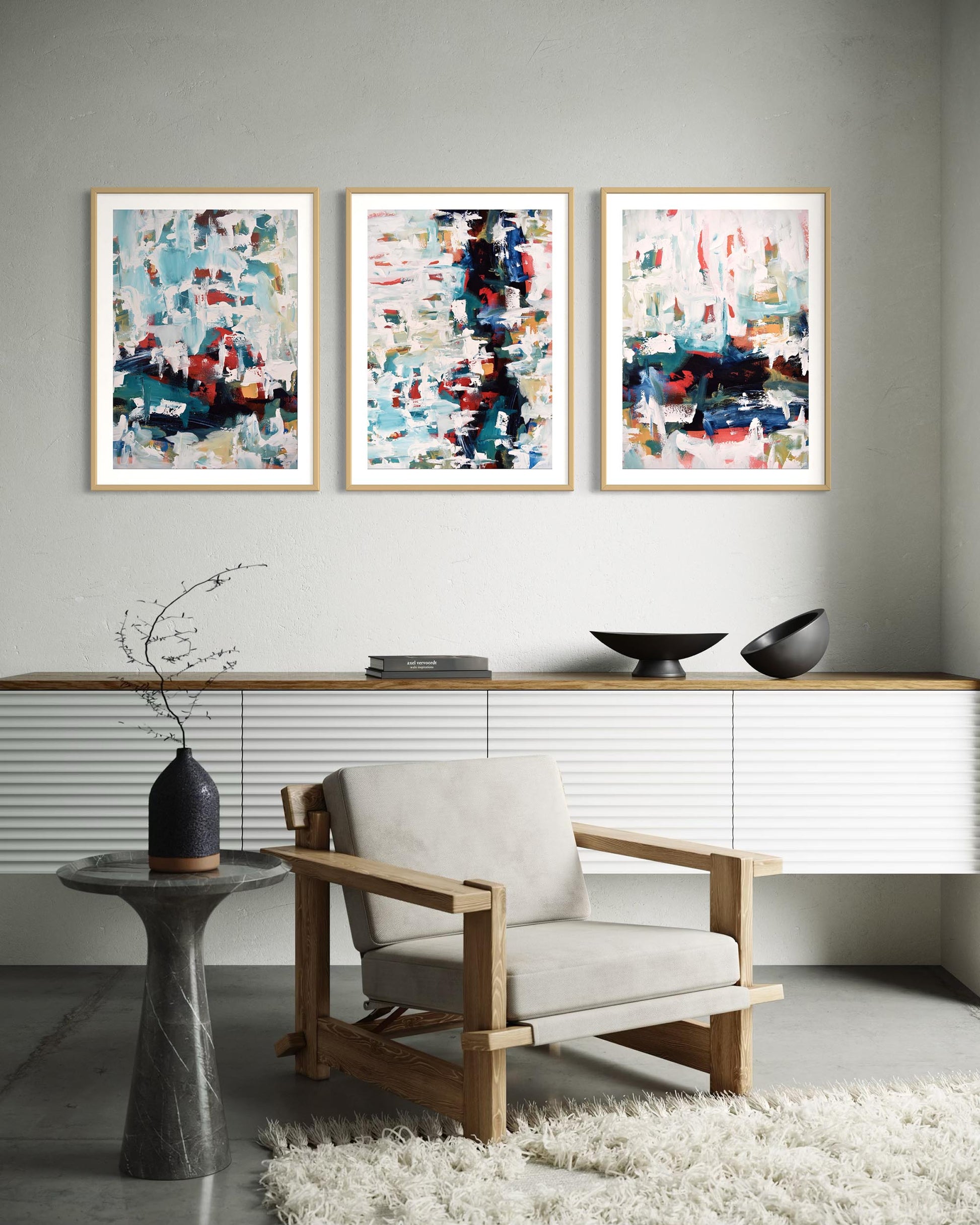 Modern interior with abstract art on the wall and a chair in the foreground.