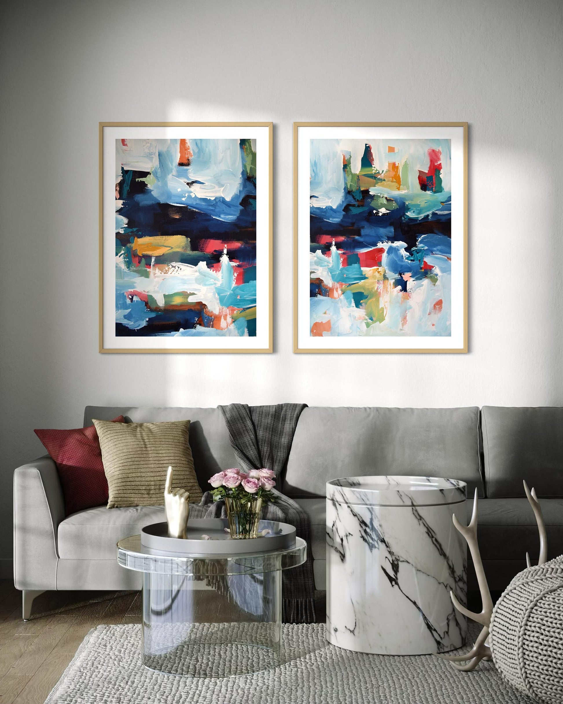 Living room with two abstract paintings on the wall, a gray sofa, and decorative items.