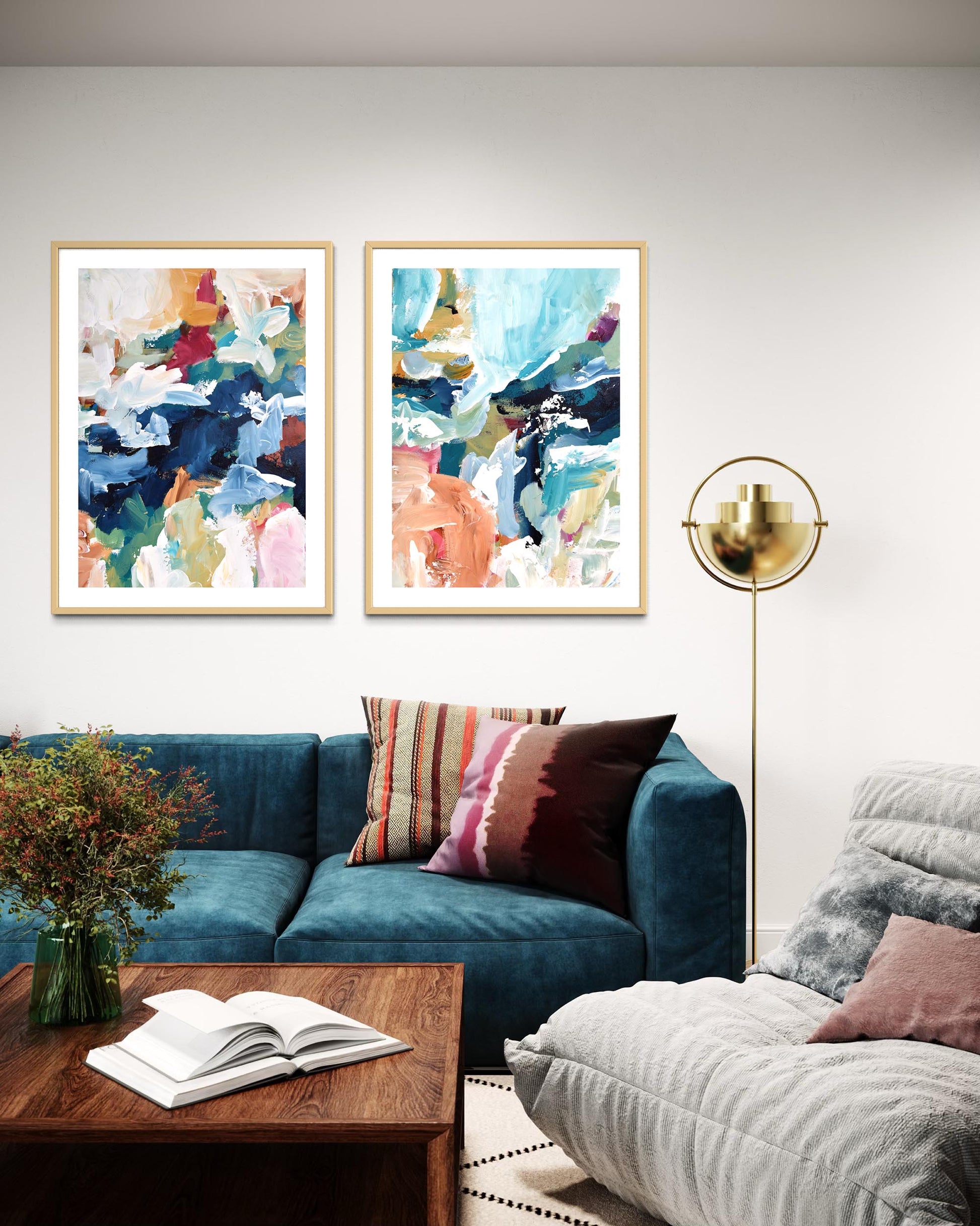 Living room with abstract art on the wall, a blue sofa, and a wooden coffee table.