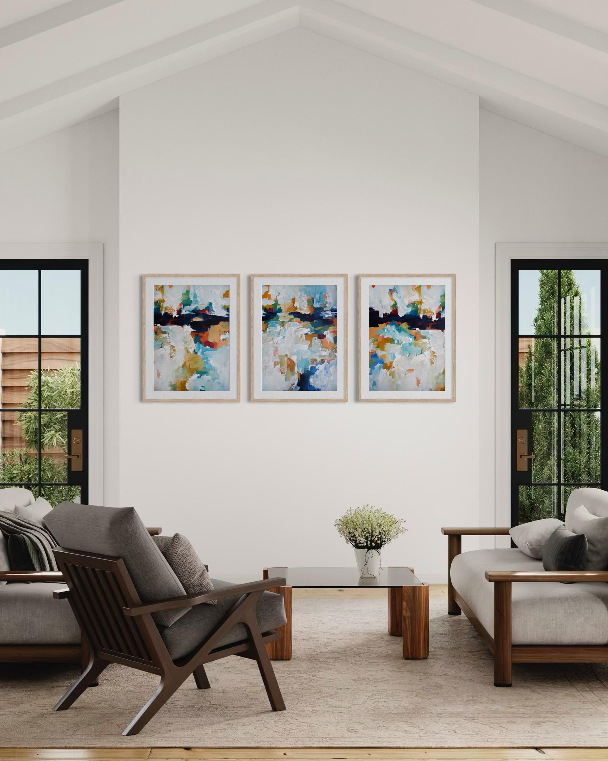 Modern living room with abstract art on the wall and wooden furniture.