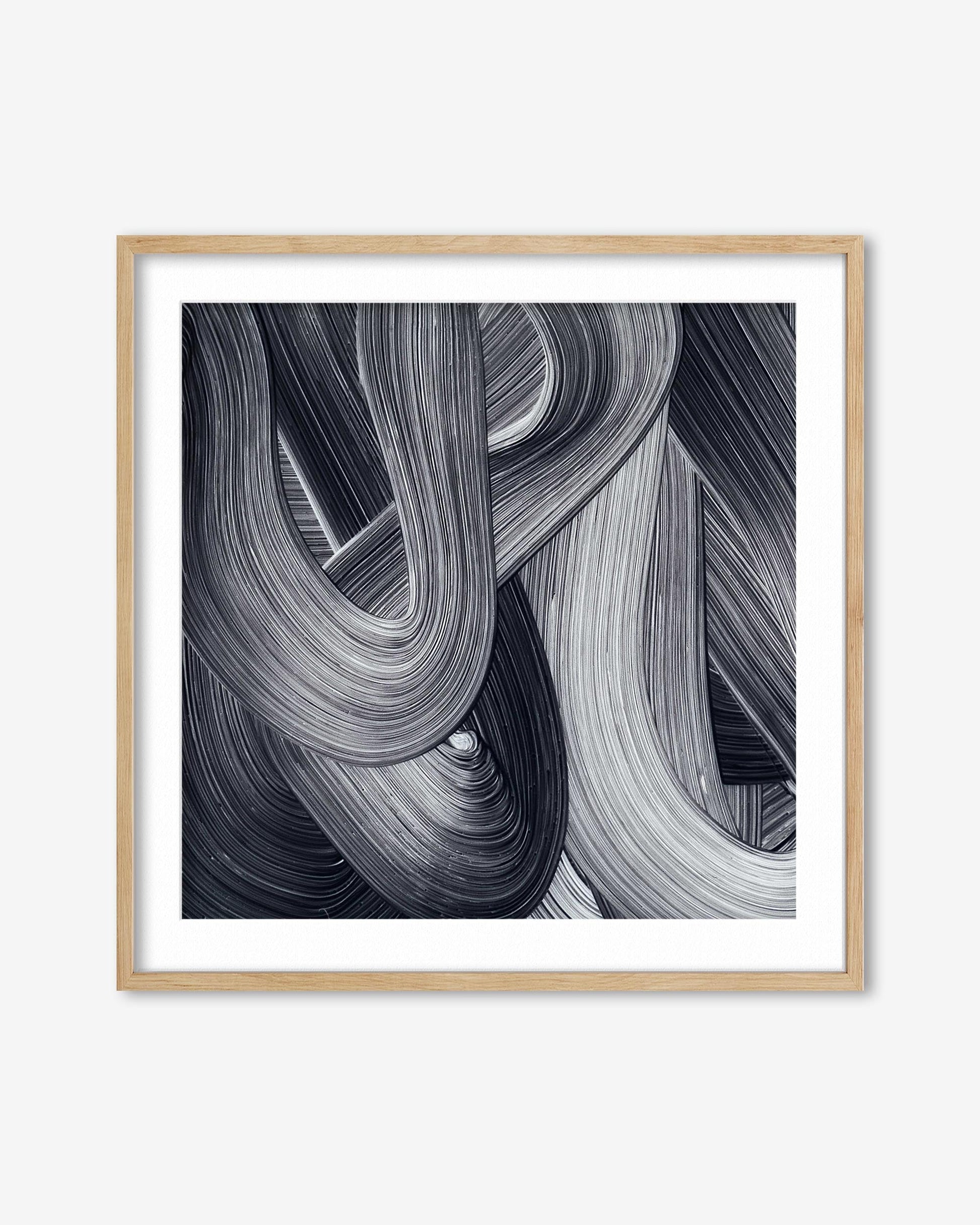 Framed abstract art print with wavy lines in black and white on a white background
