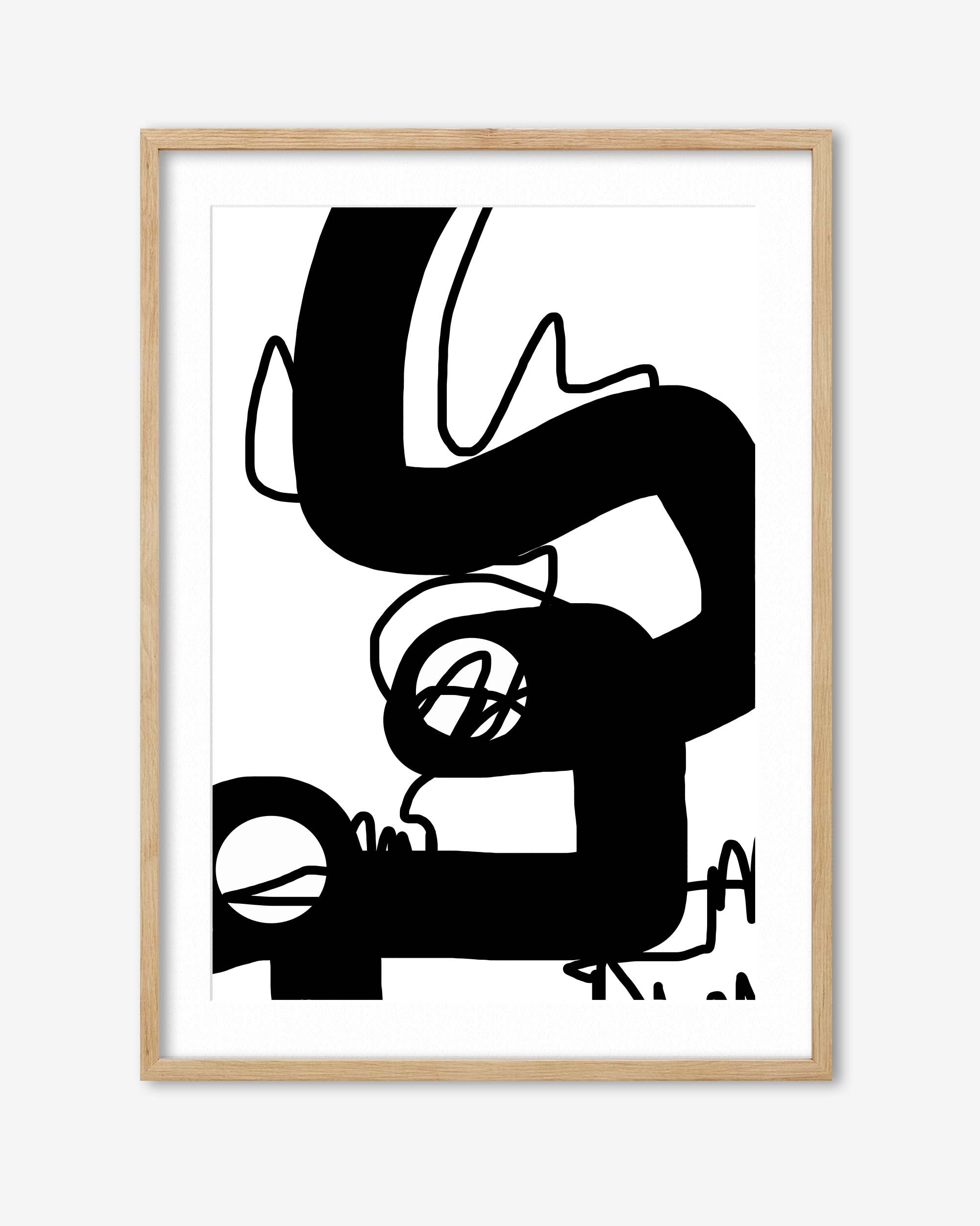 Abstract black and white artwork in a wooden frame on a white background