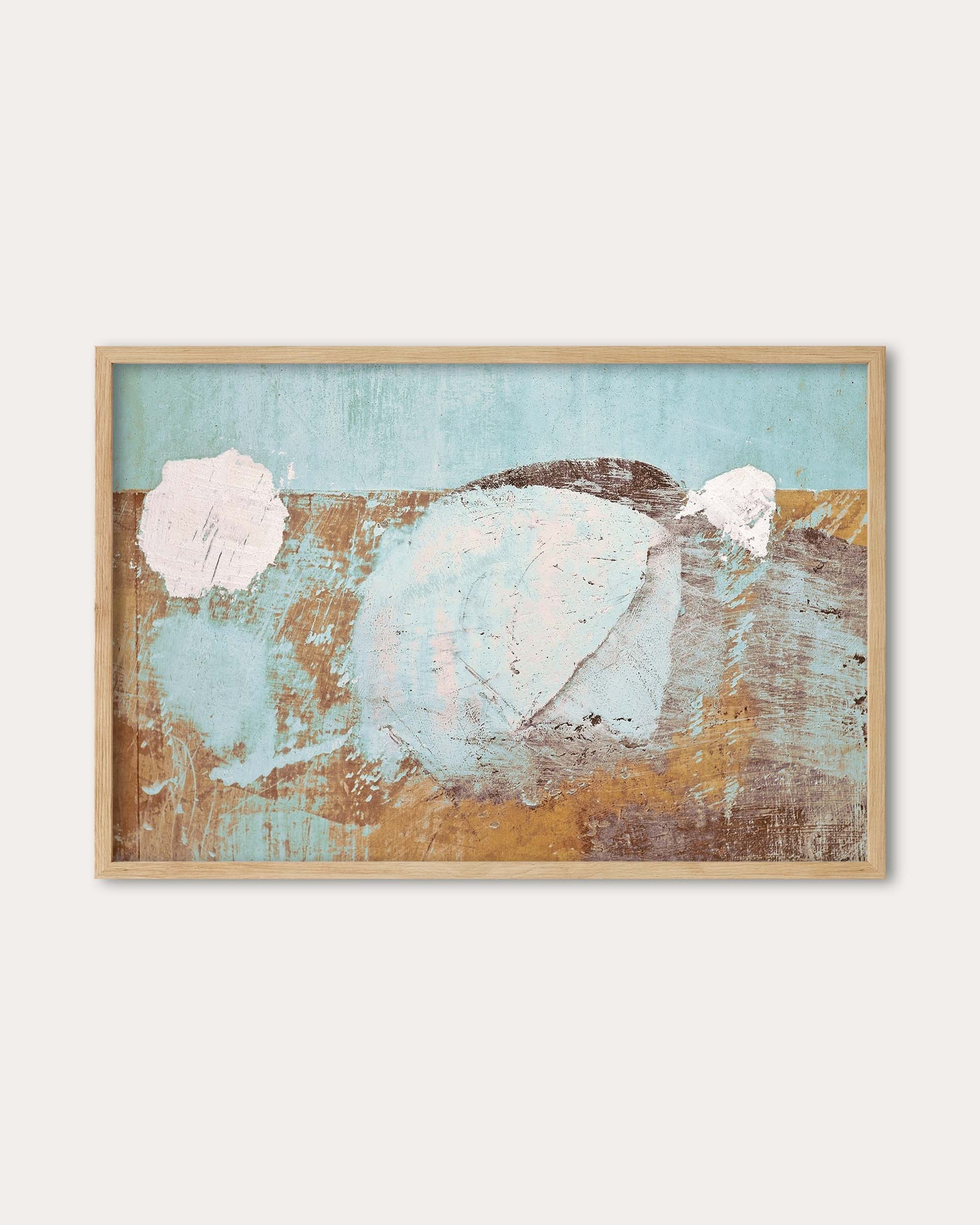 Framed abstract art with pastel colors on a white wall