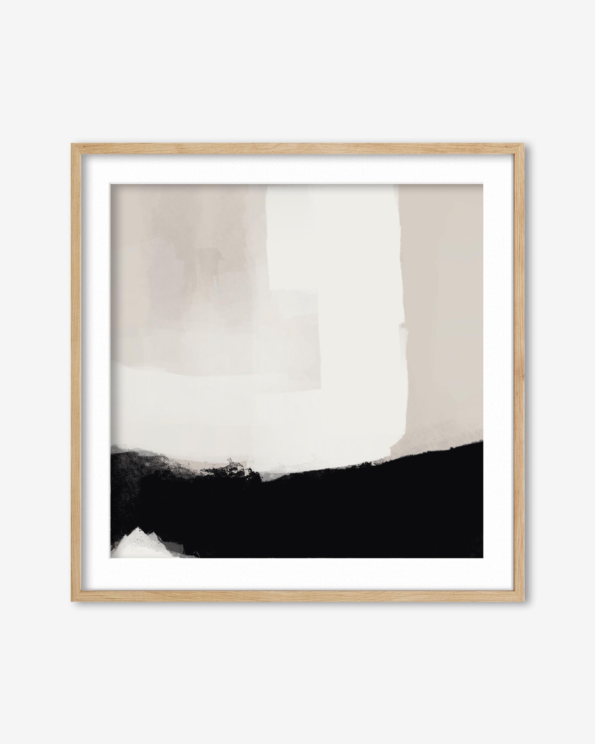 Abstract art print with black and white brush strokes in a wooden frame on a white background