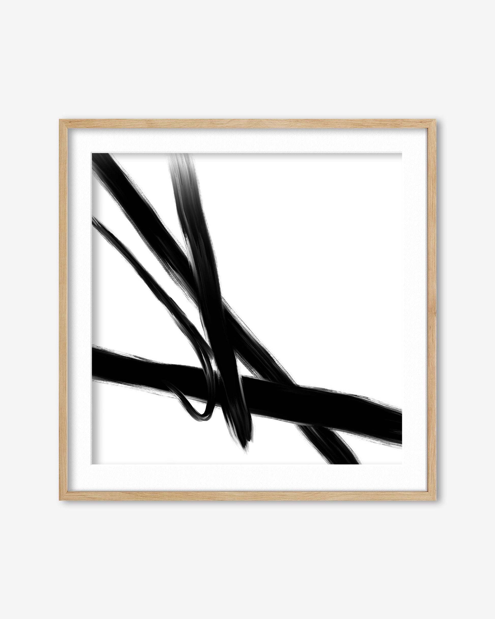 Framed artwork of black abstract lines on a white background