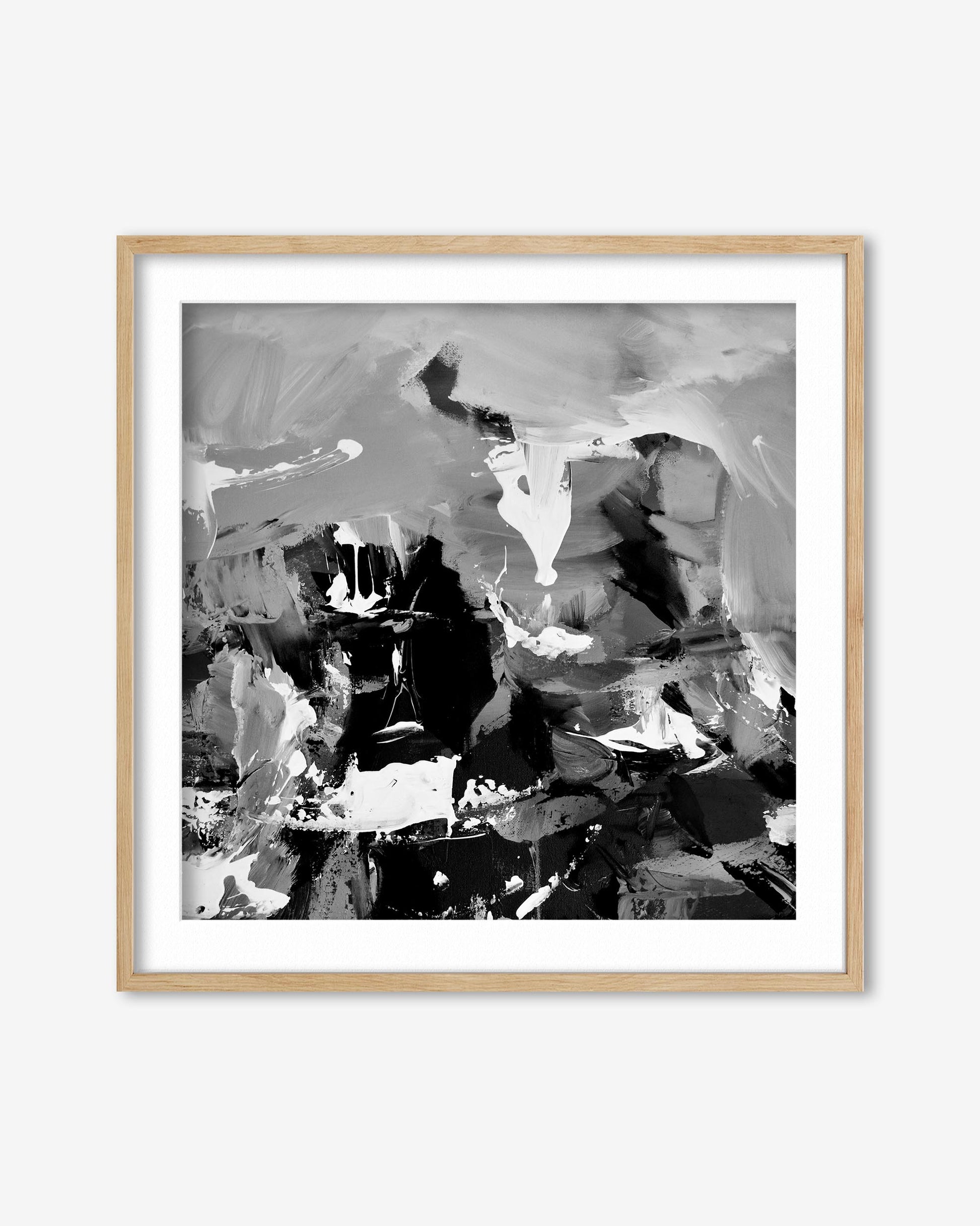 Abstract black and white artwork in a wooden frame on a white background