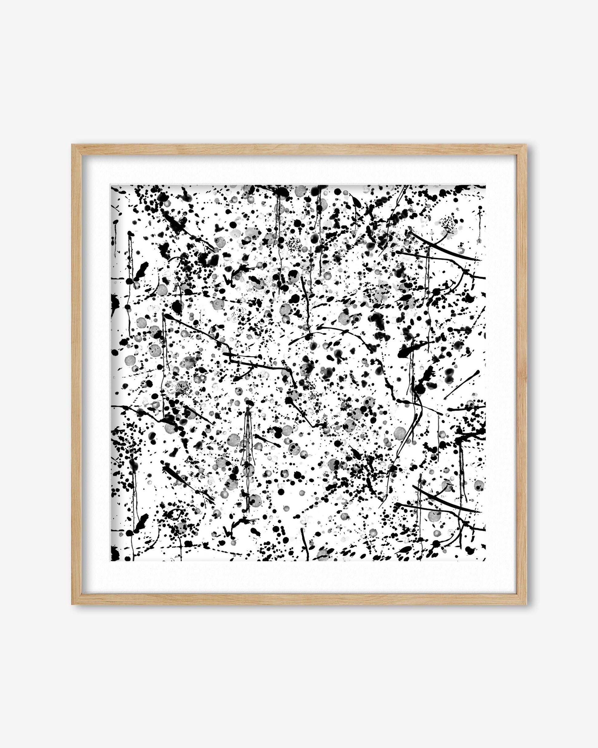 Framed abstract art print with black and white pattern on a white background