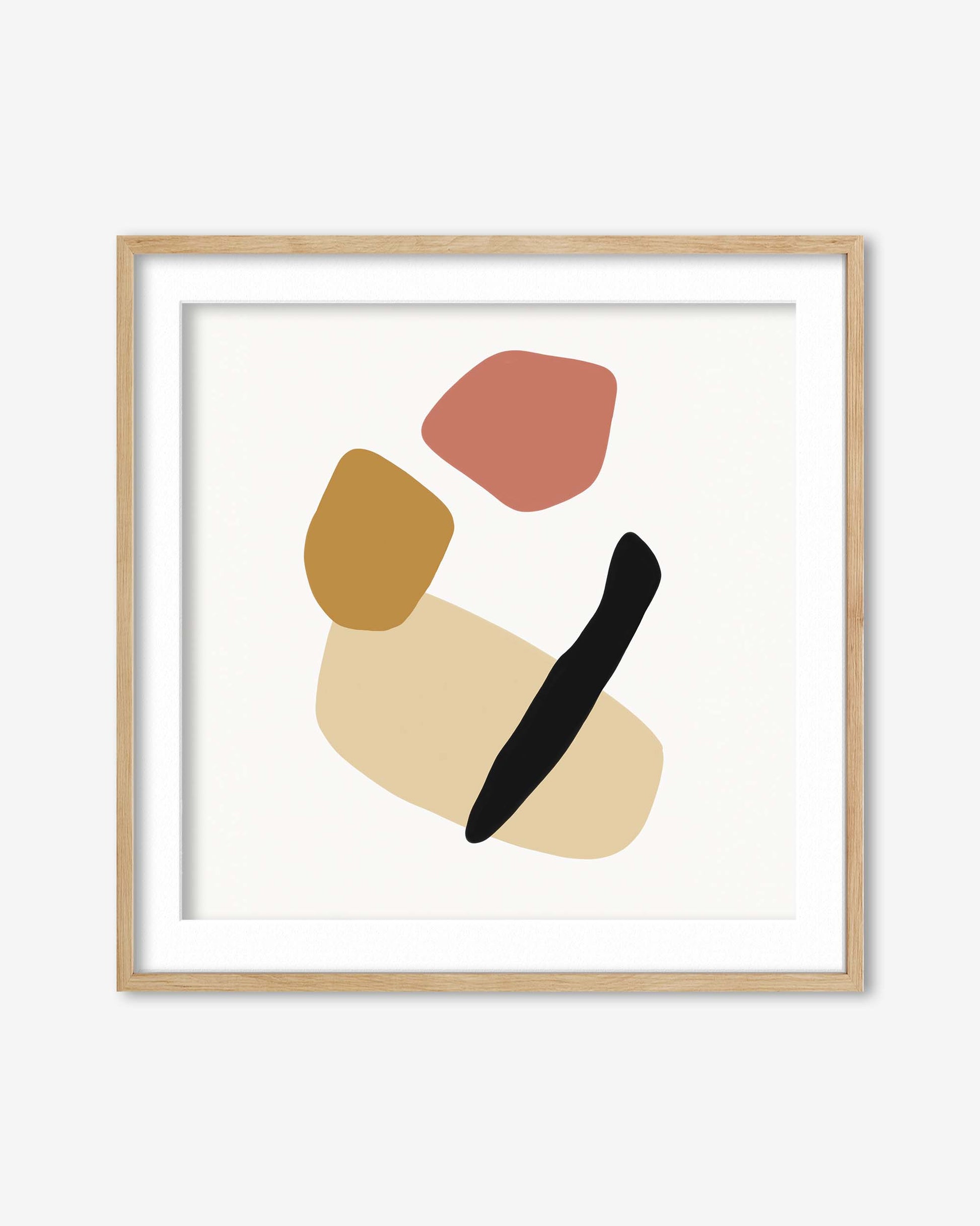 Abstract art print with colorful shapes in a wooden frame on a white background