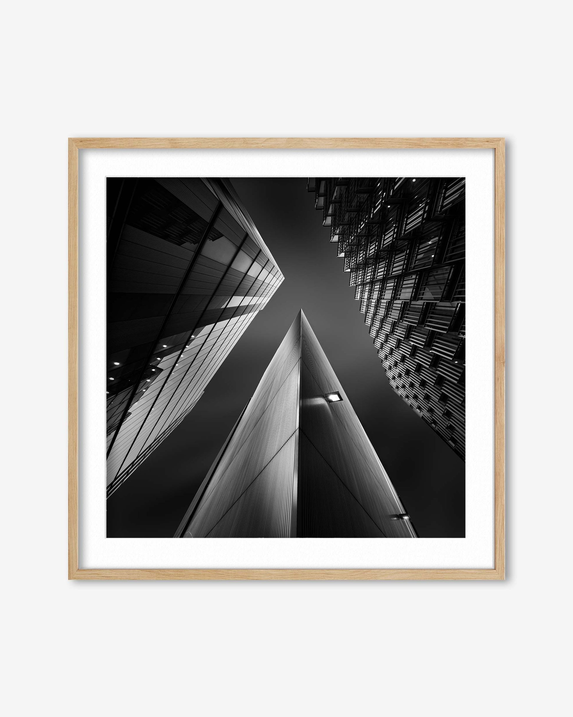 Framed black and white architectural photograph of a building corner.