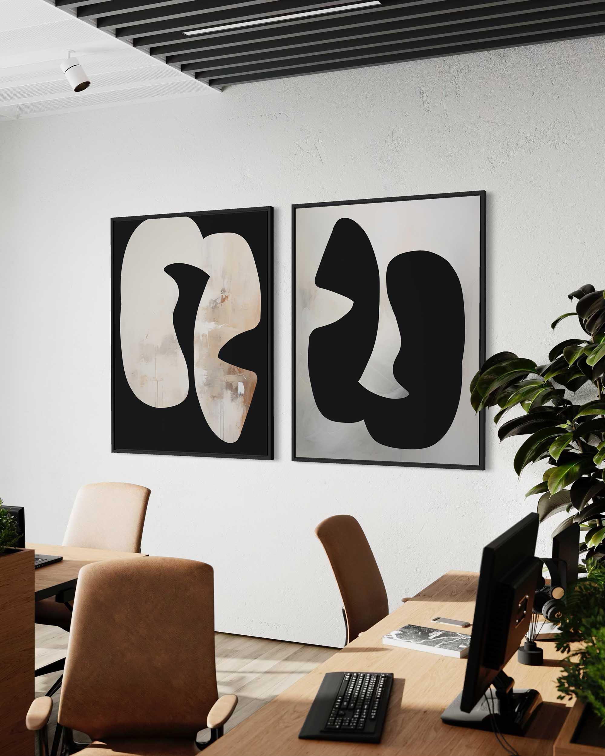Modern office interior with abstract art on the wall and desks with computers.