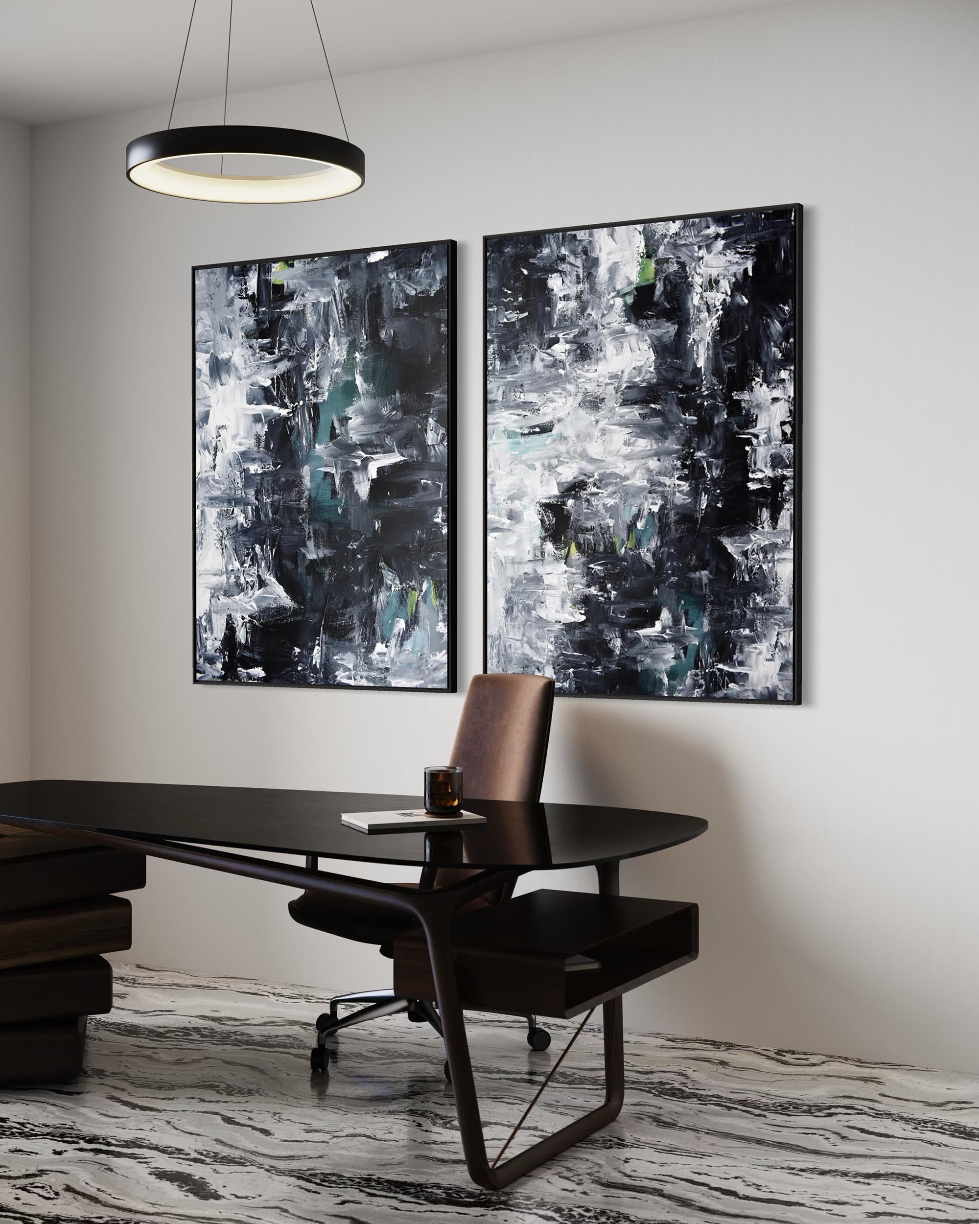 Modern office setup with a desk and abstract art on the wall.
