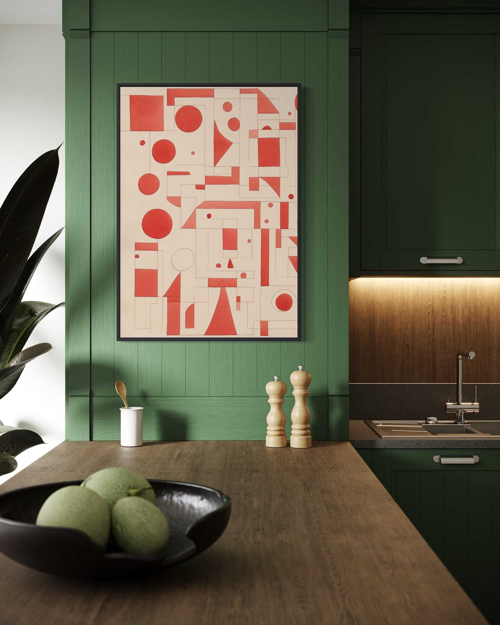 Modern kitchen with geometric art on a green wall, wooden counter, and fruit bowl.