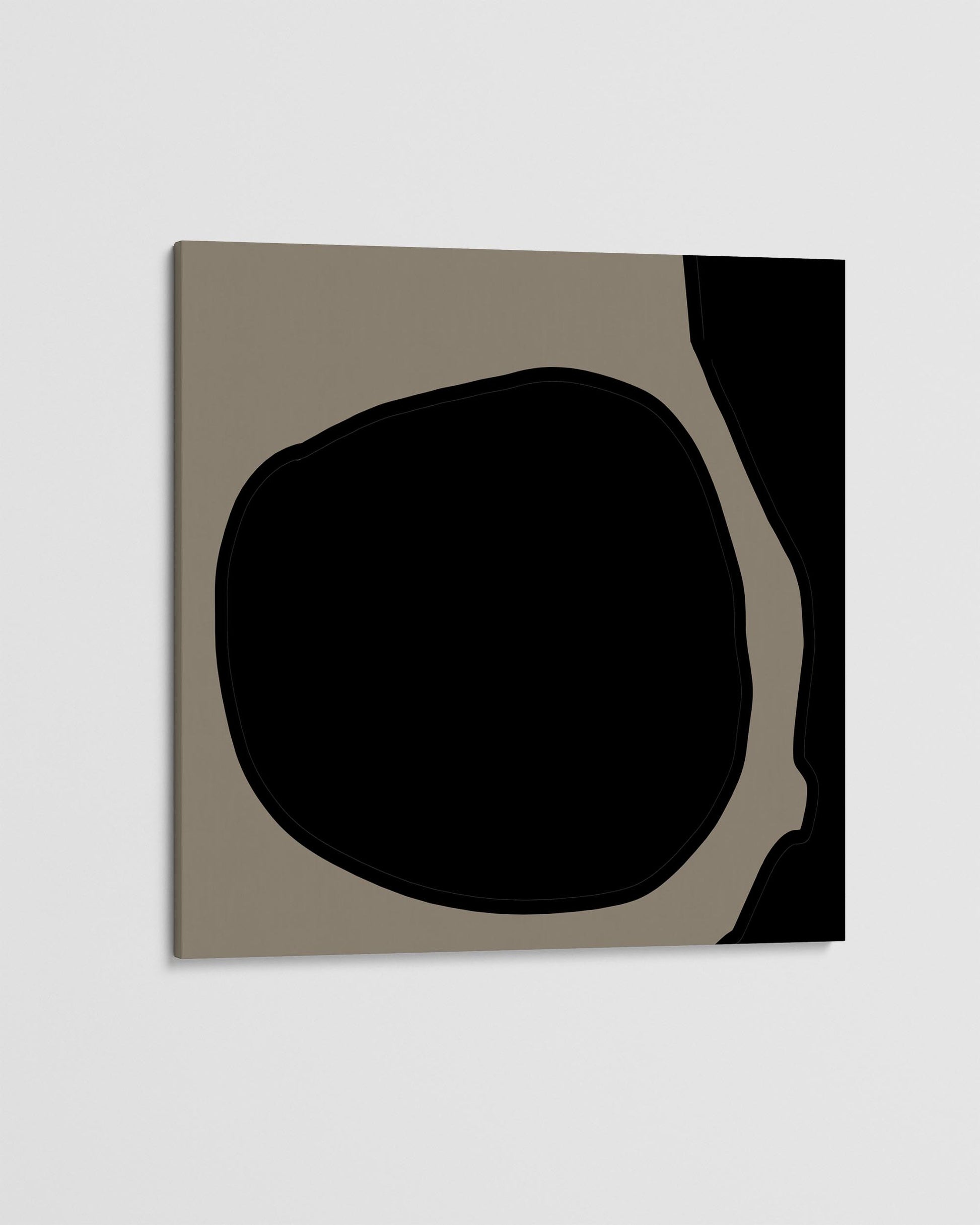 Abstract art piece with a black shape on a beige background