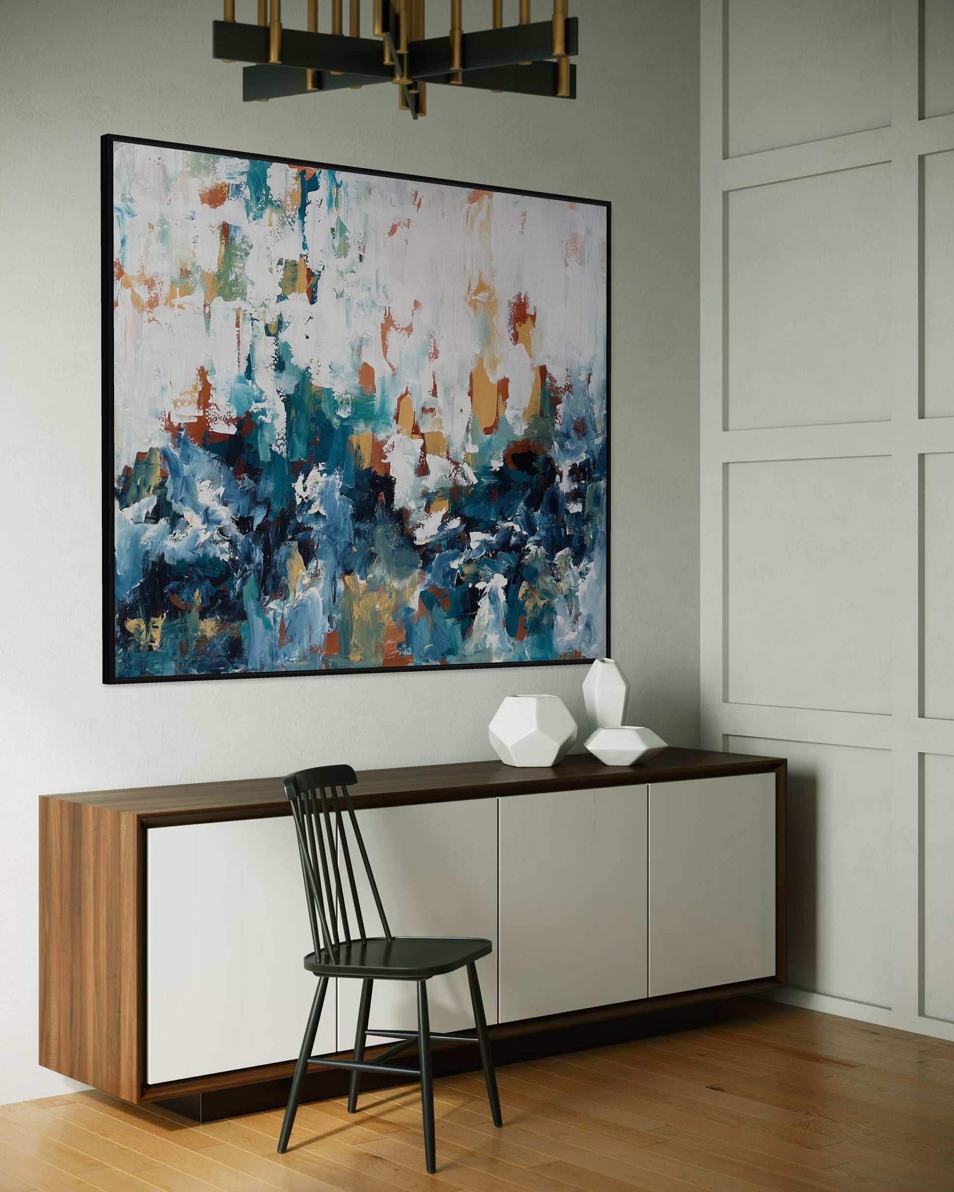 Modern interior with abstract painting, console table, and chair.