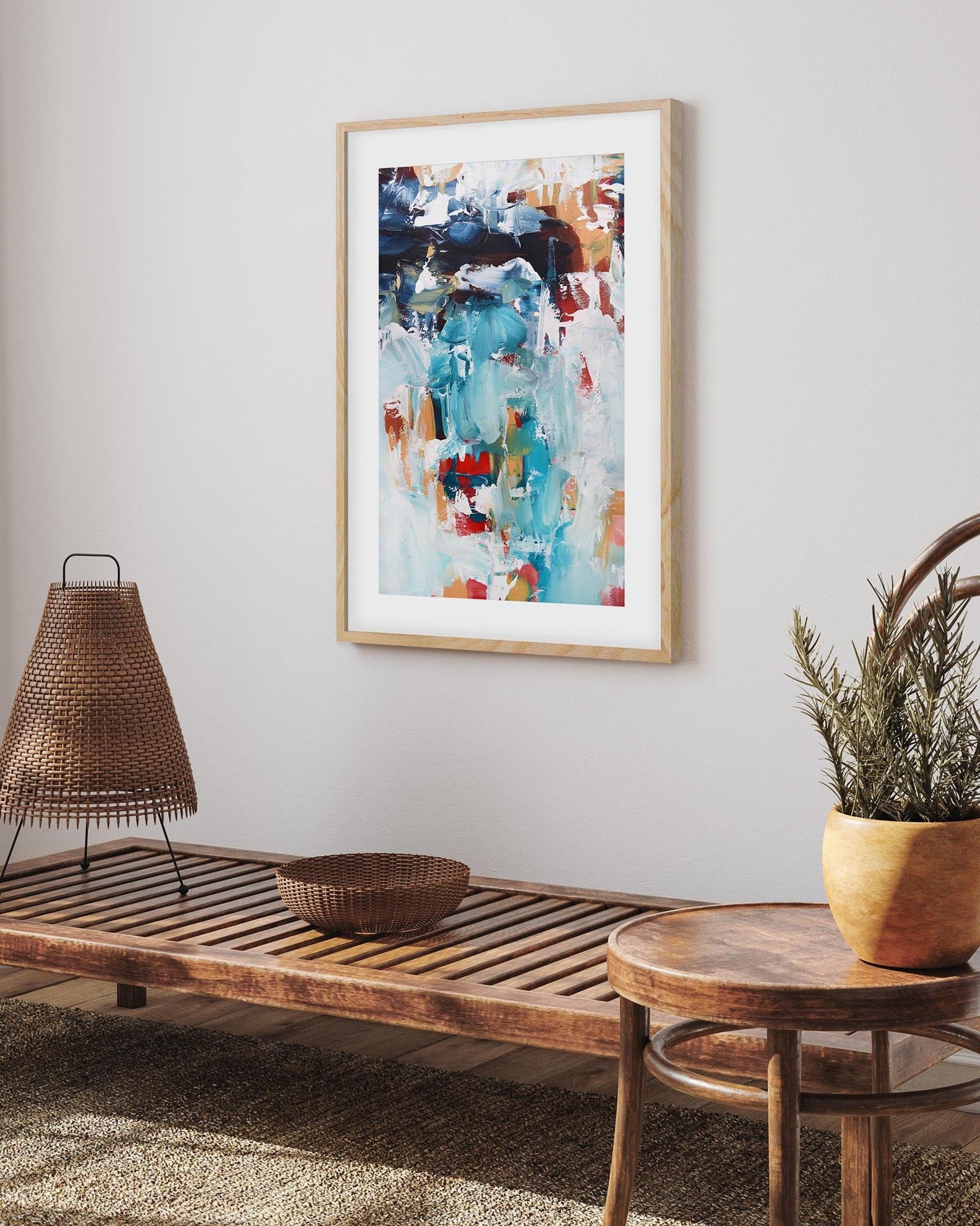 abstract art print in an oak frame on a wall