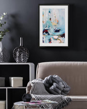 Living room with a sofa, coffee table, and wall art