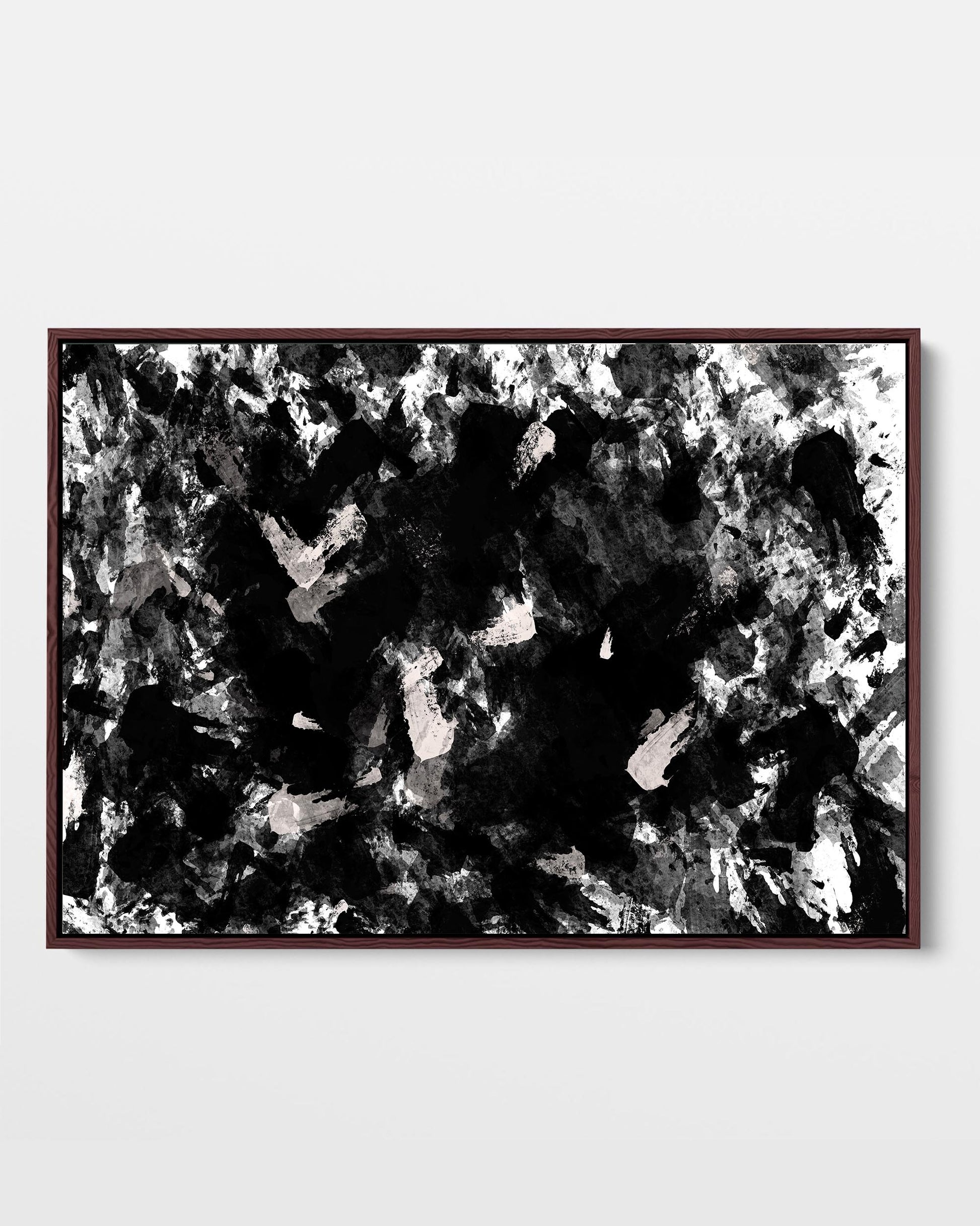 A framed black and white abstract canvas with a textured pattern.