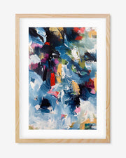 A framed art print featuring abstract colorful artwork with prominent shades of blue, white, yellow, green, and red.