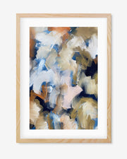A framed art piece with abstract design, featuring rich browns, vibrant blues and oranges, displayed in a light wooden frame.