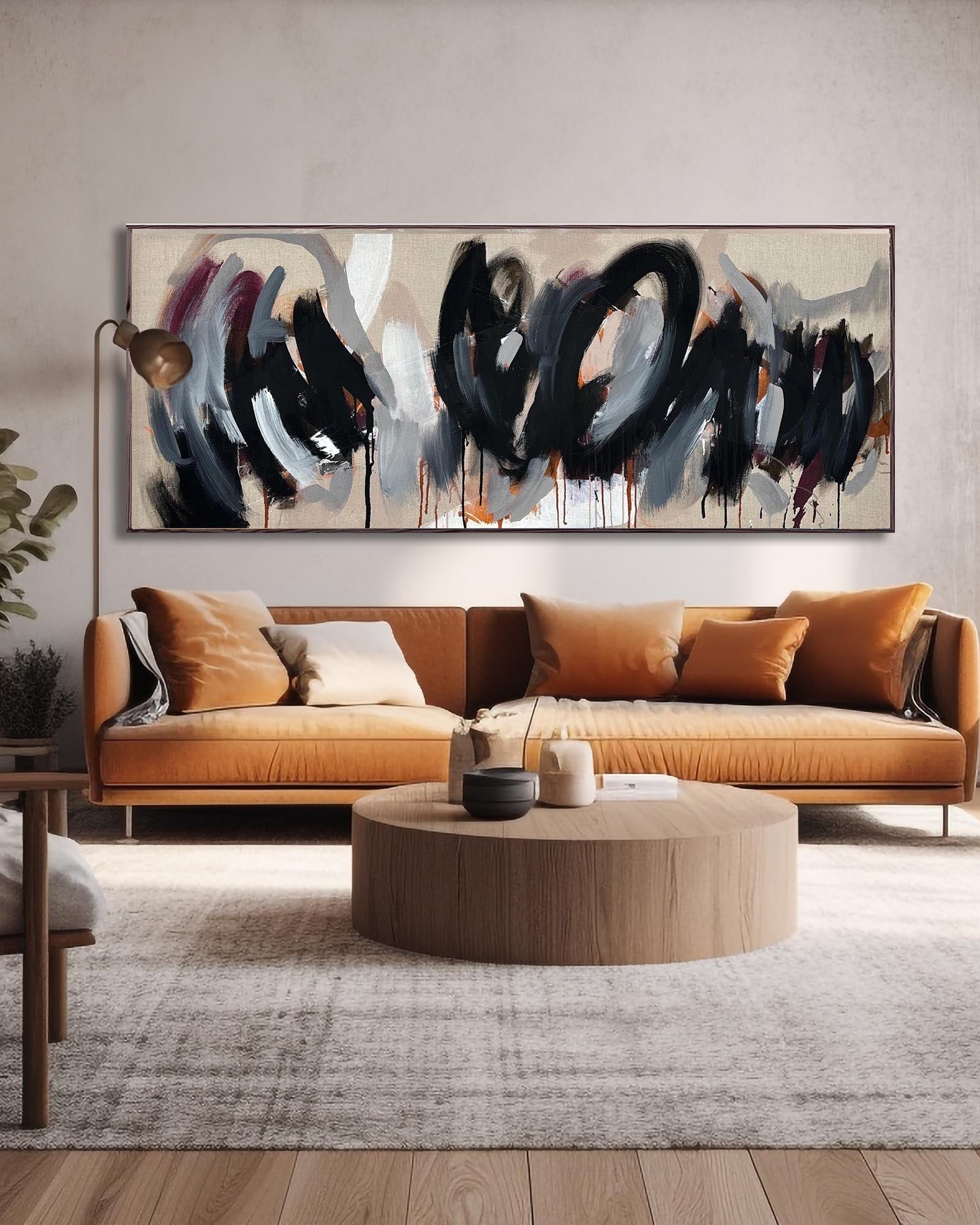 Extra large original abstract painting in a frame above a sofa in a modern living room