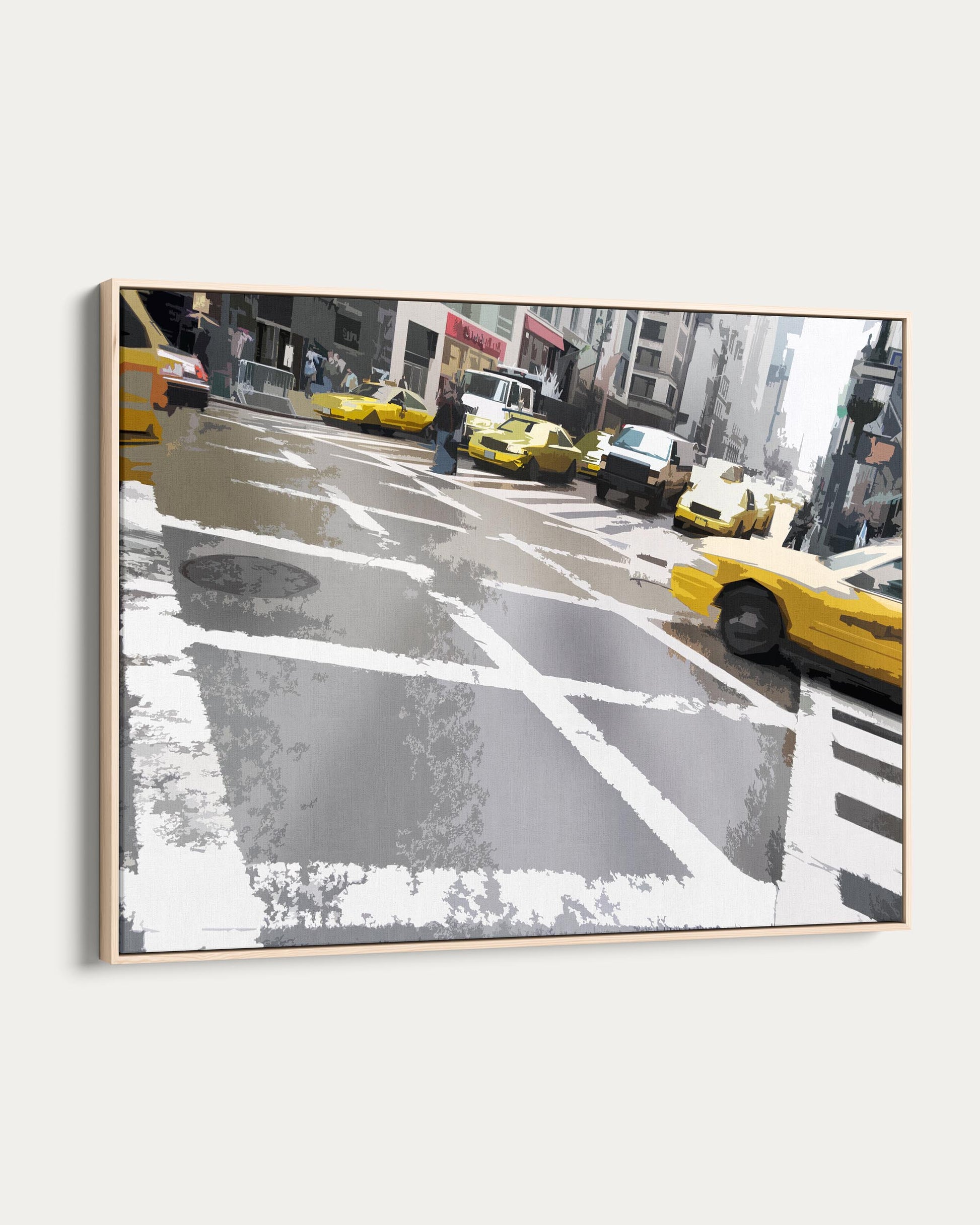 Framed artwork of a city street with yellow taxis and pedestrians.