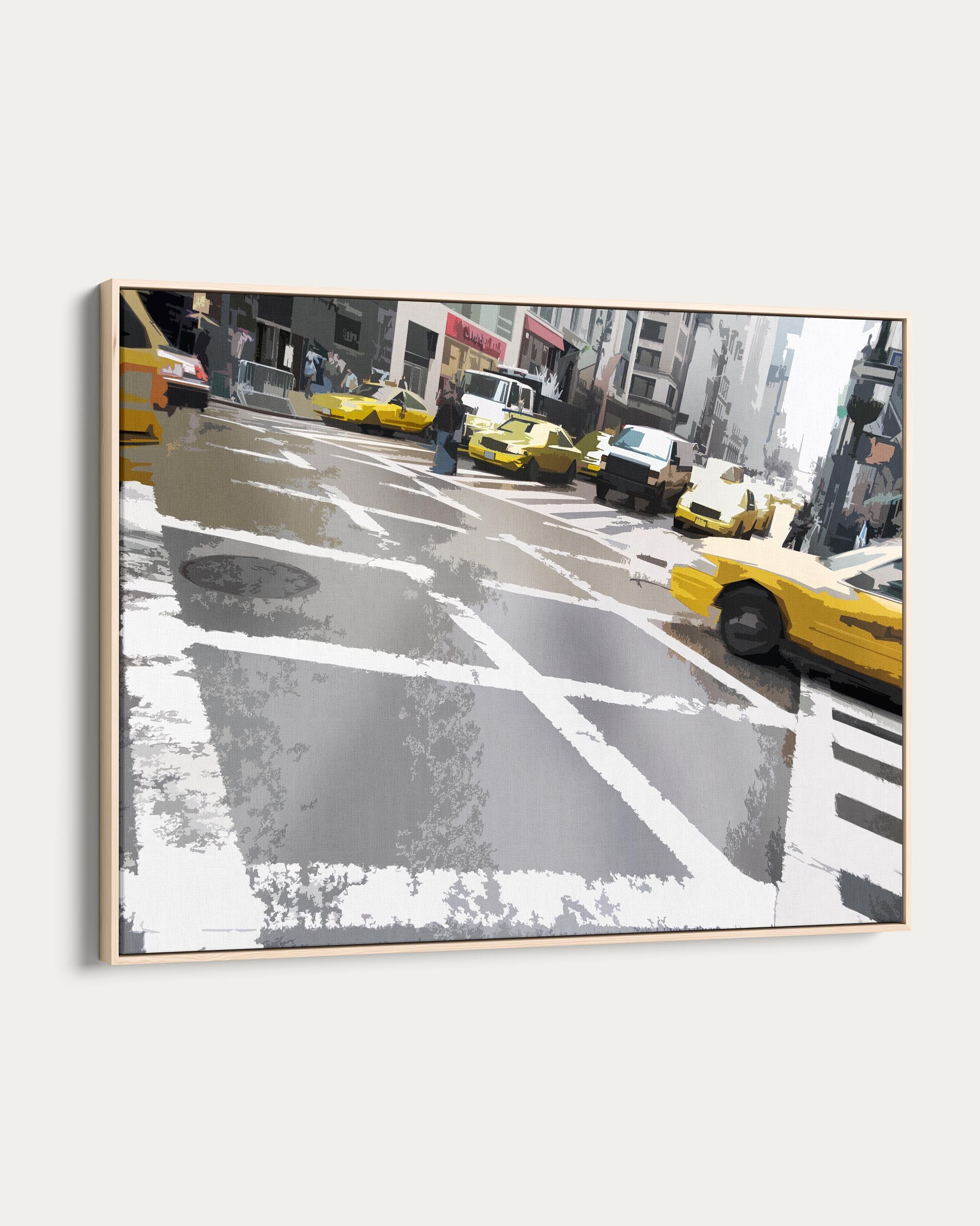 Framed artwork of a city street with yellow taxis and pedestrians.