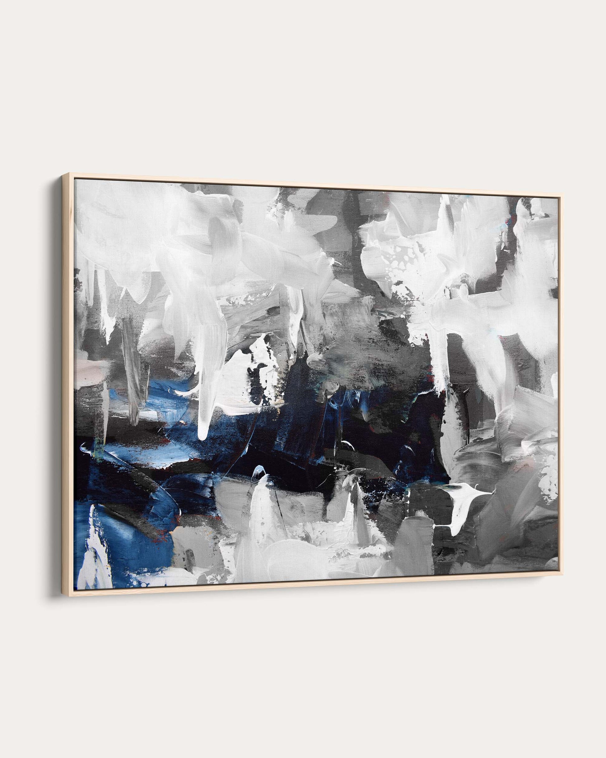 Abstract art painting with blue and gray tones on a white wall