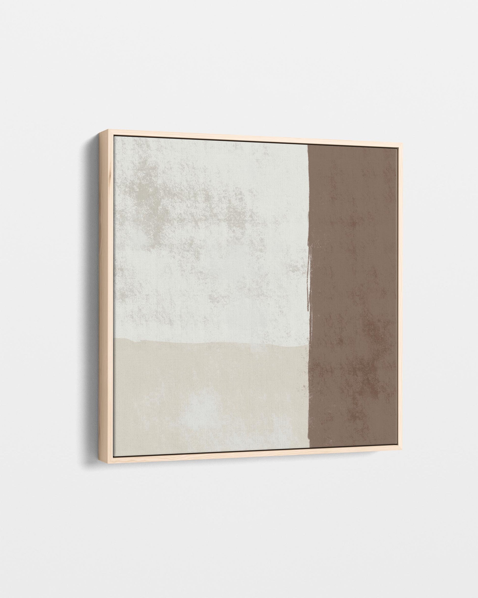 Abstract art piece with a gold frame on a white wall