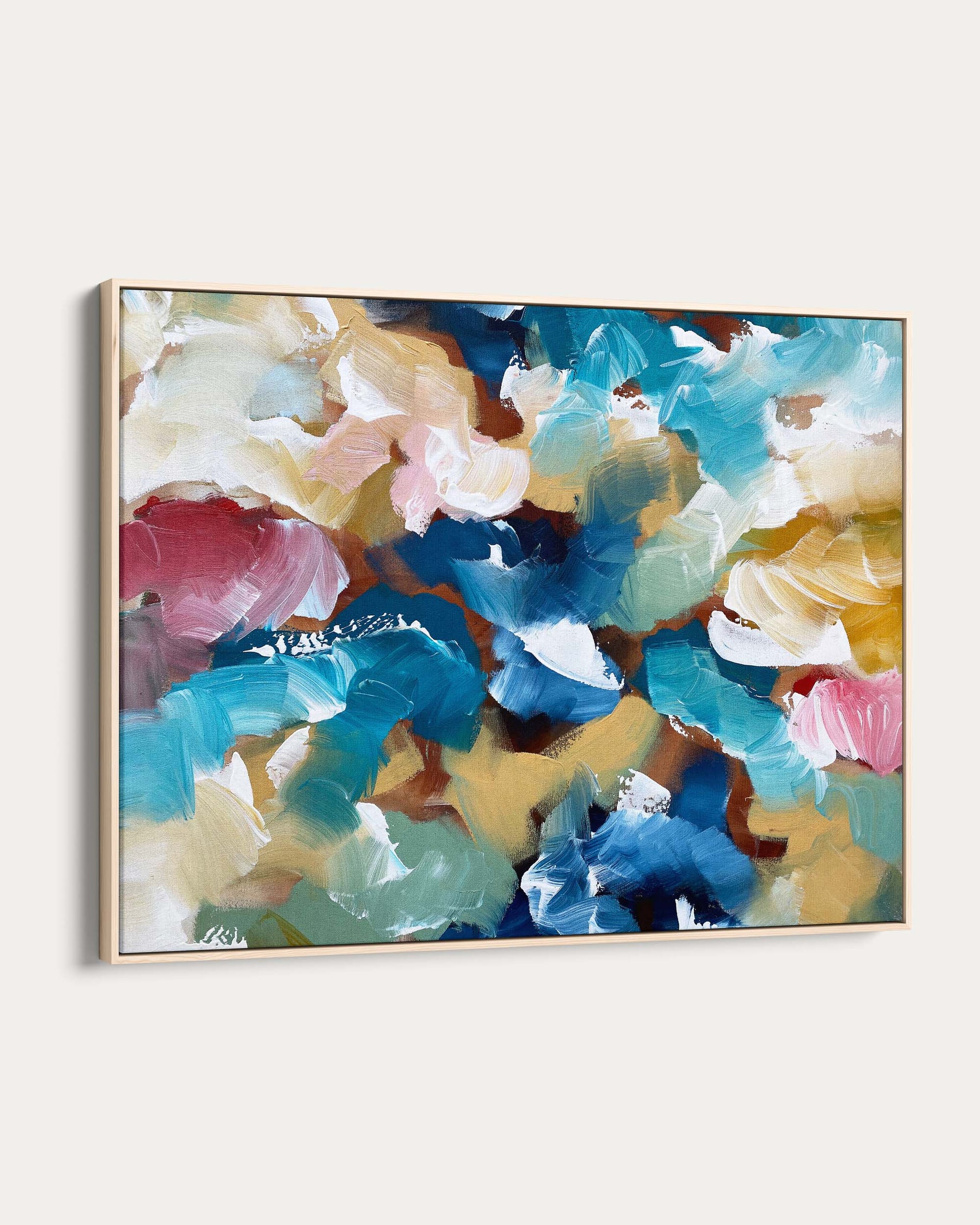 Abstract painting with colorful floral patterns in a gold frame on a white background