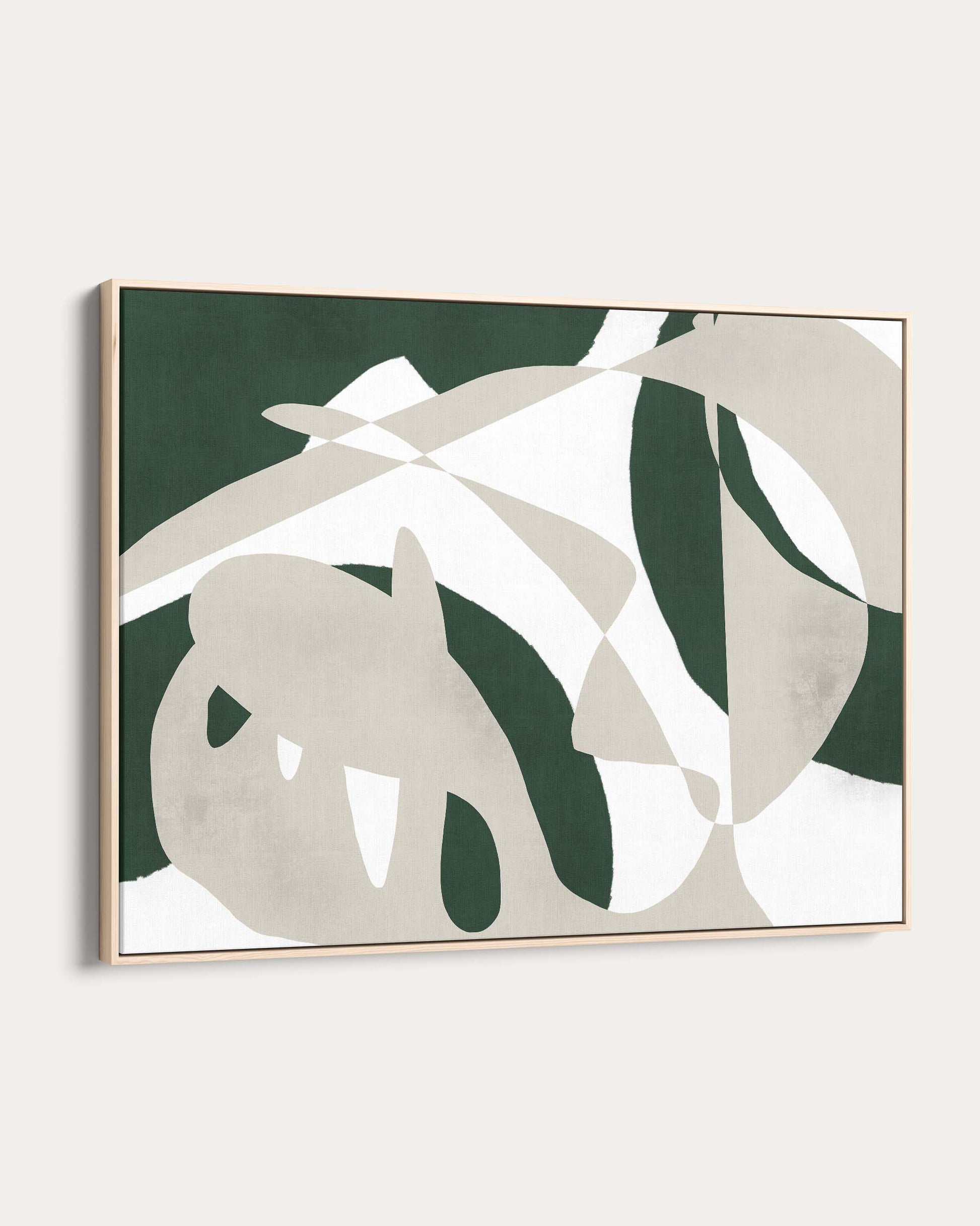 Framed artwork with green and beige abstract leaf design on a white wall