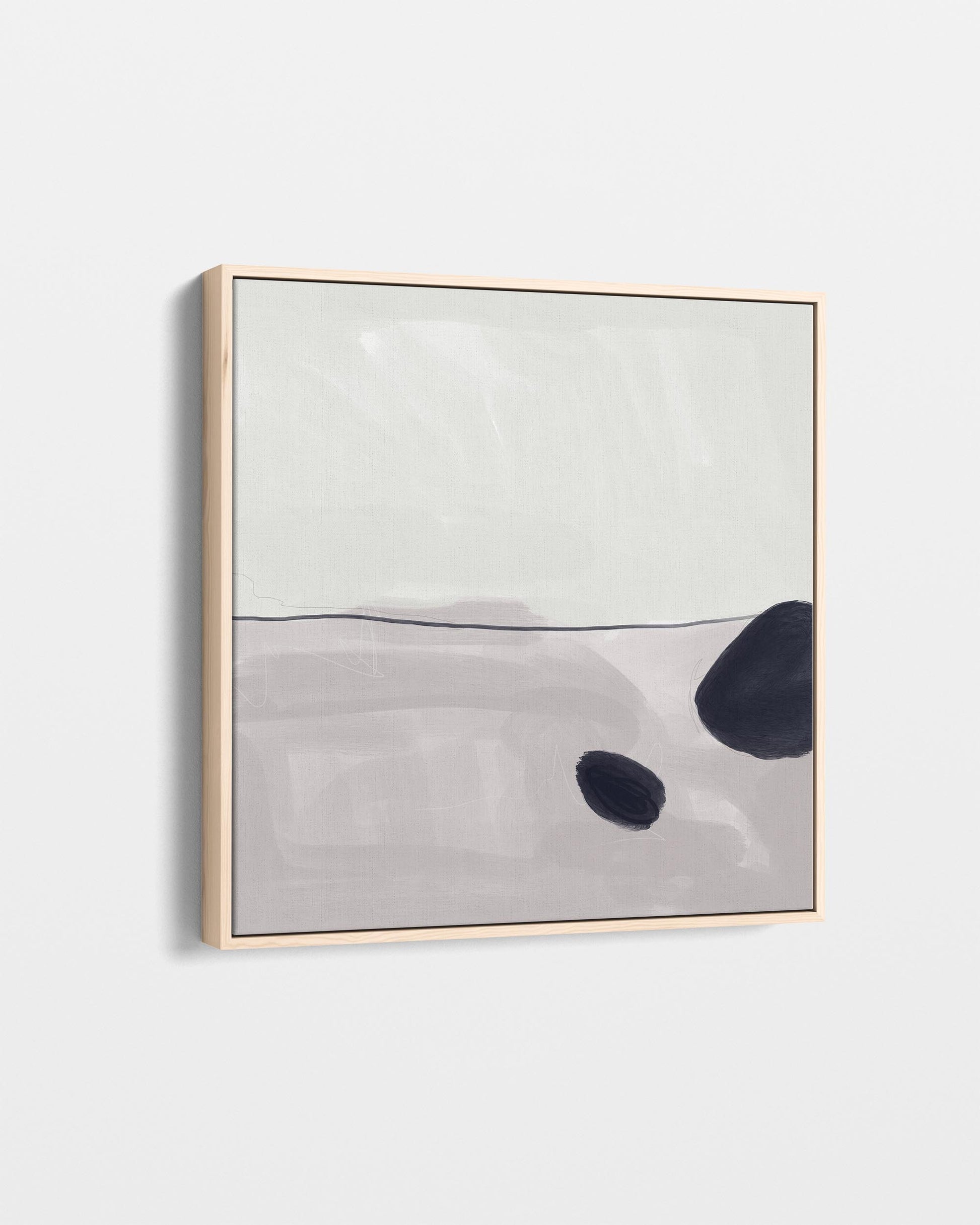 Abstract art piece with black and gray shapes on a light gray background