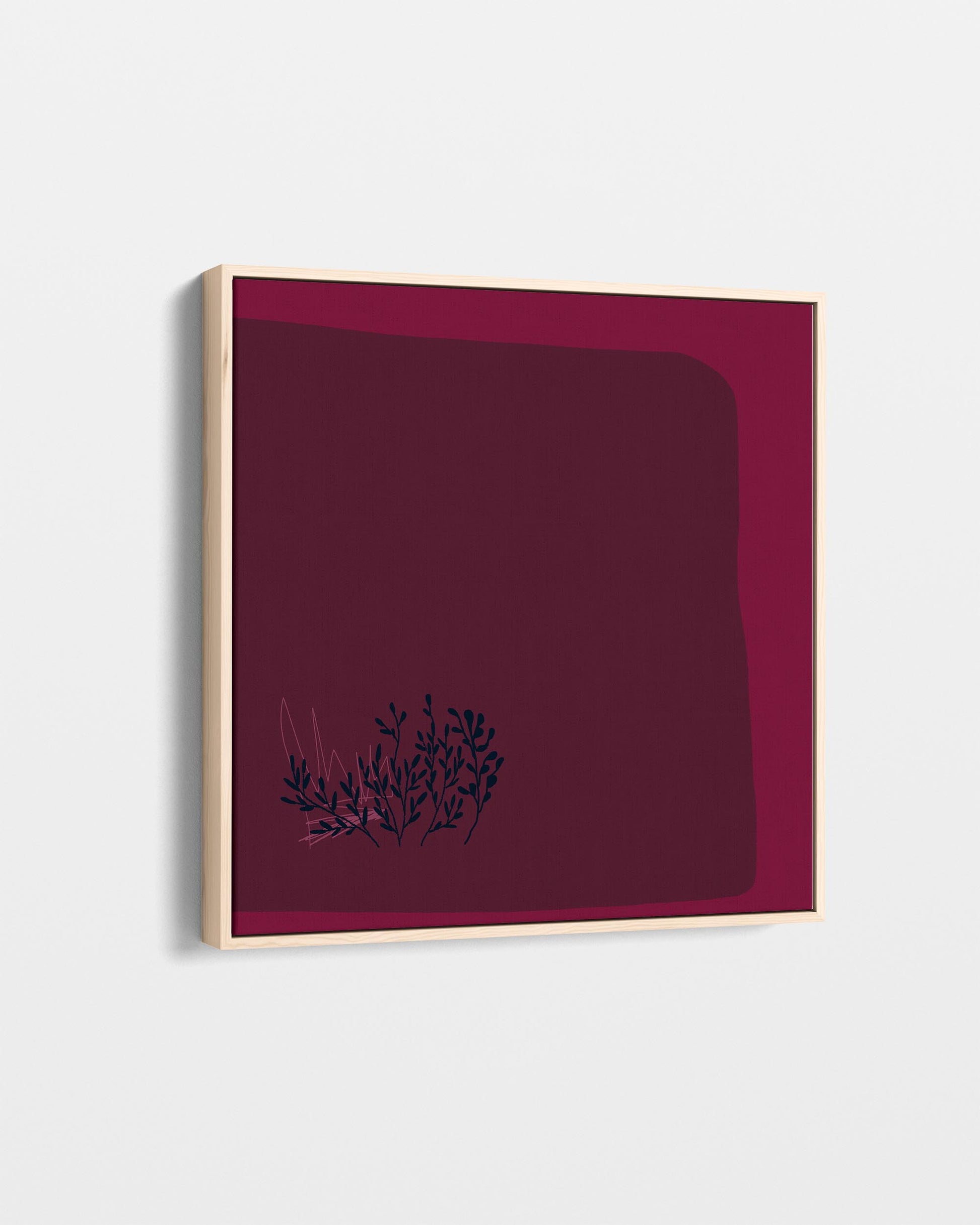 Framed artwork with a dark red background and black floral design on a white background