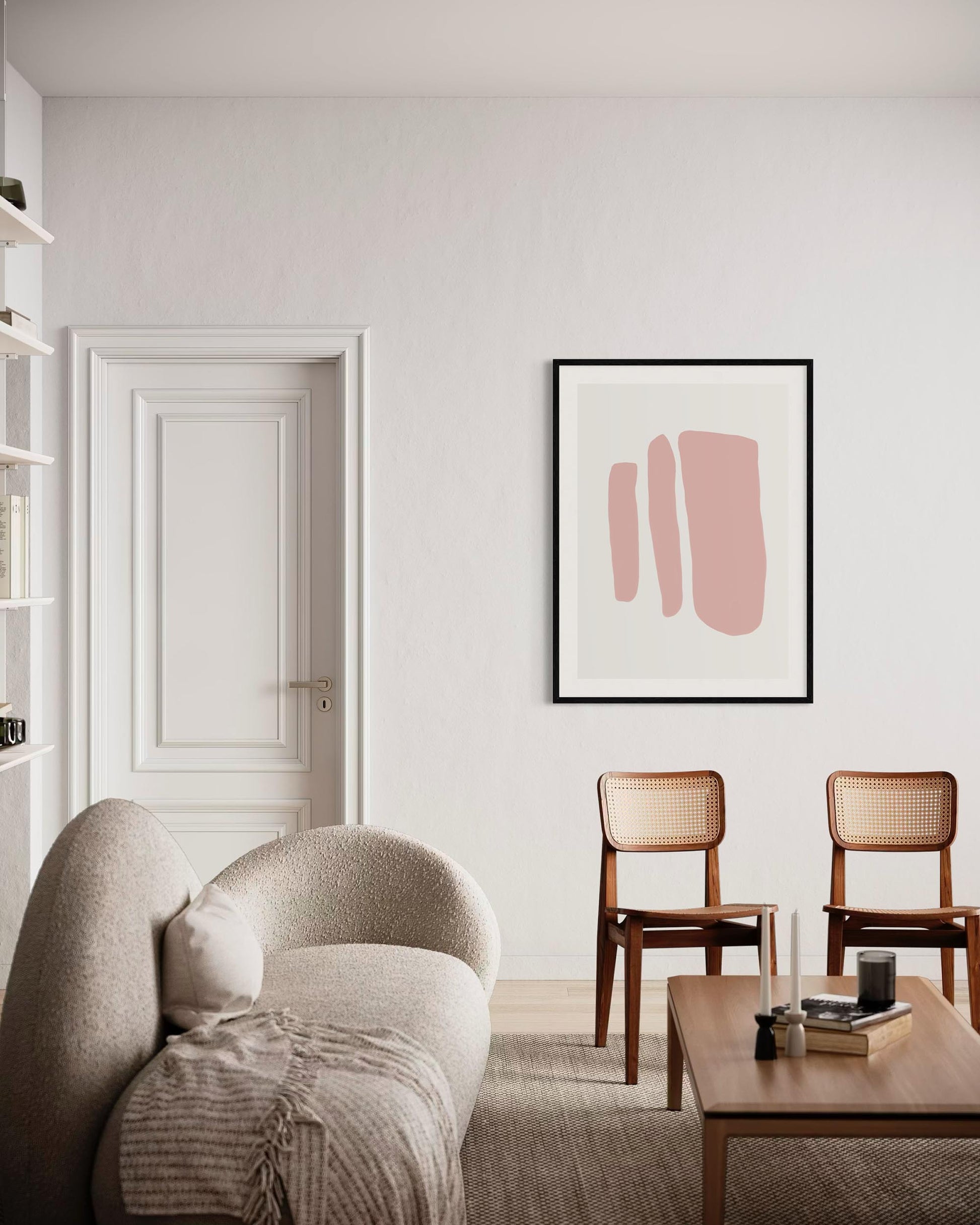 Modern living room with a beige armchair, wooden coffee table, and abstract pink art on the wall.