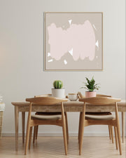 Dining room with wooden table and chairs, abstract art on the wall, and potted plants.