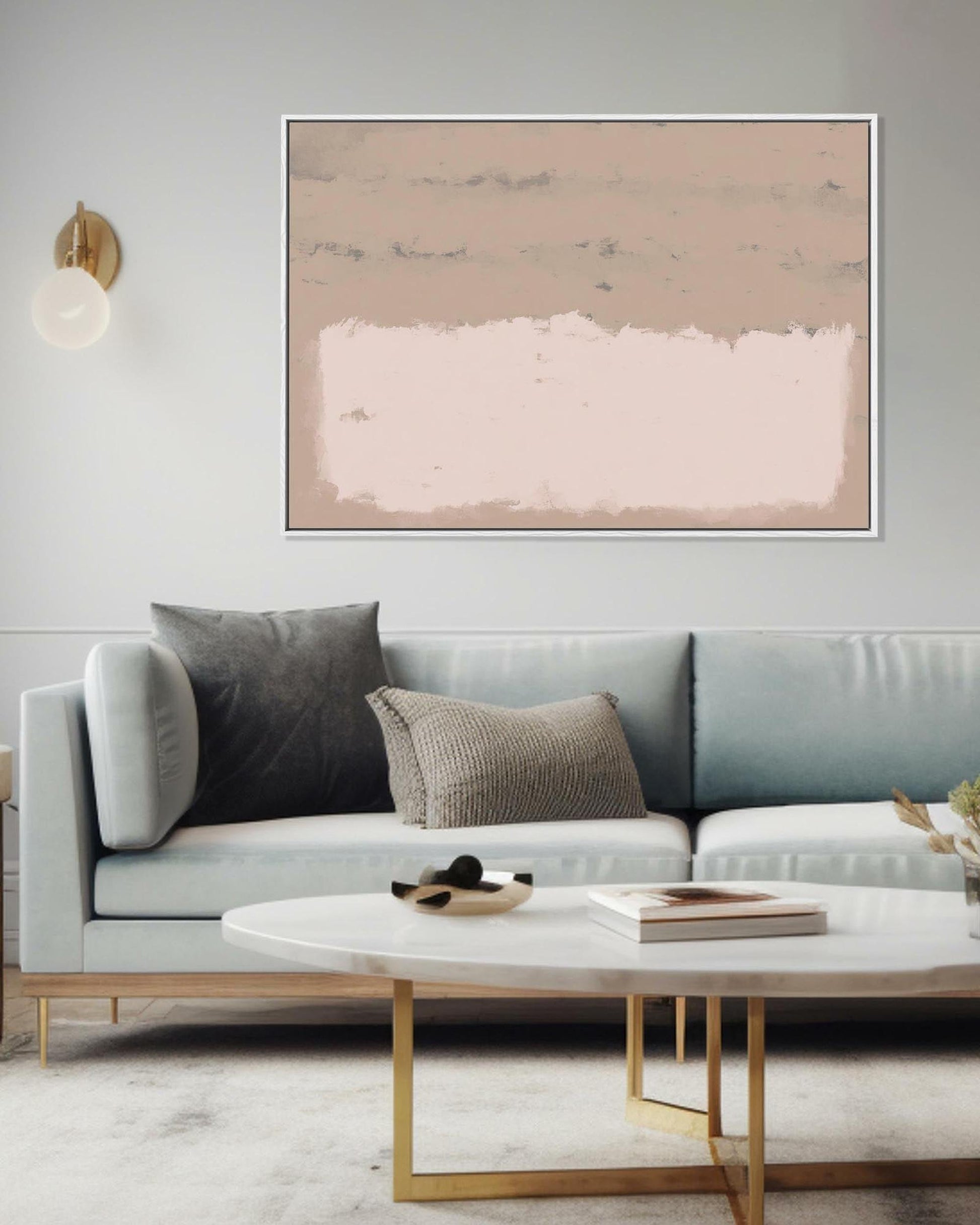 Modern living room with a light gray sofa, abstract painting, and marble coffee table.