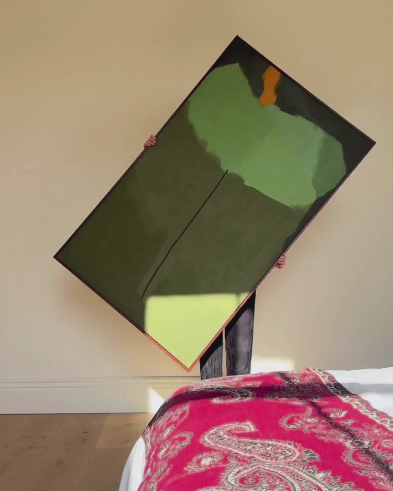 video of a woman showcasing and hanging large Rothko green abstract canvas