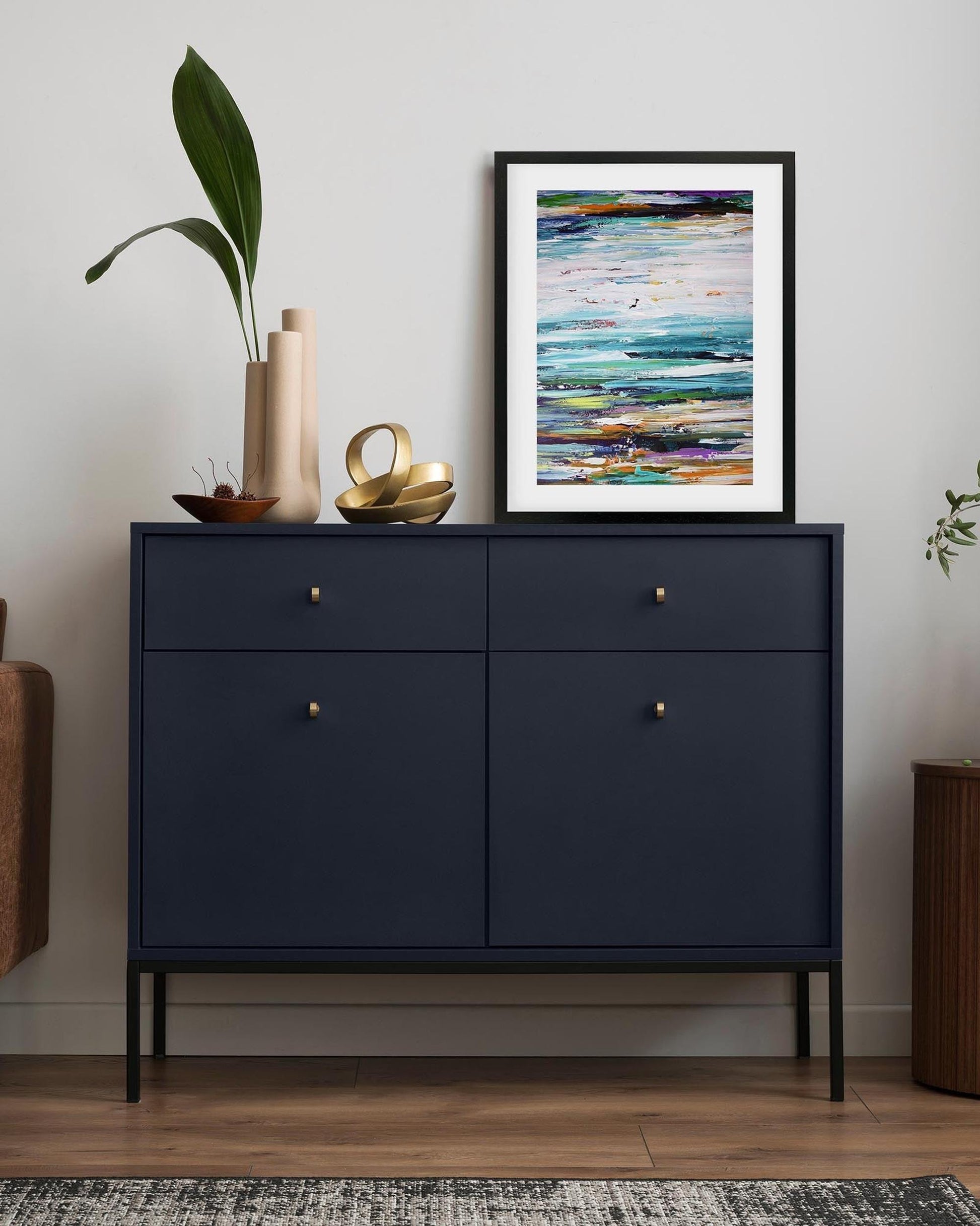 framed seascape abstract print on sideboard