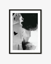 Framed black and white abstract art print on a white wall
