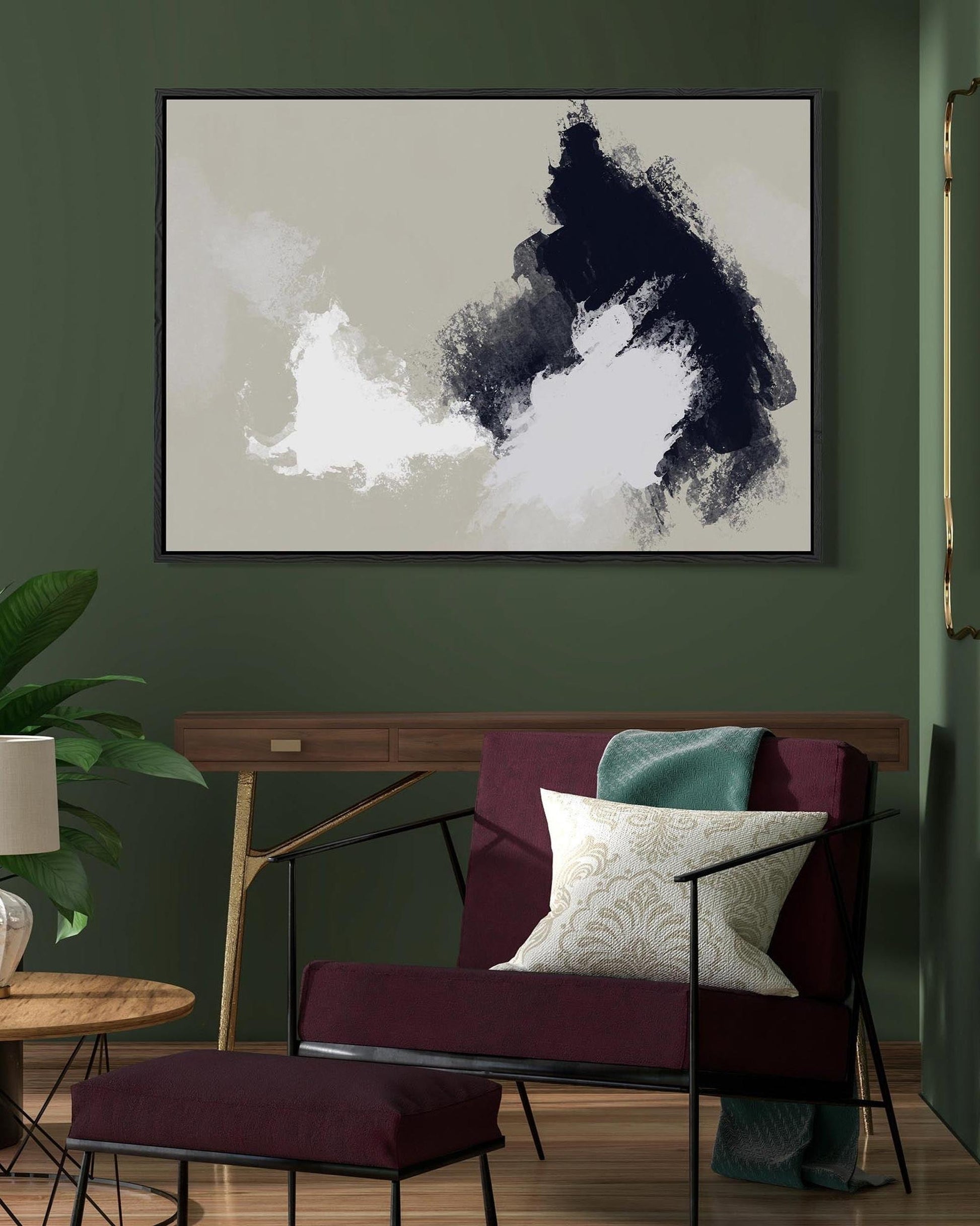 Abstract art piece on a wall in a living room with a sofa and decor.