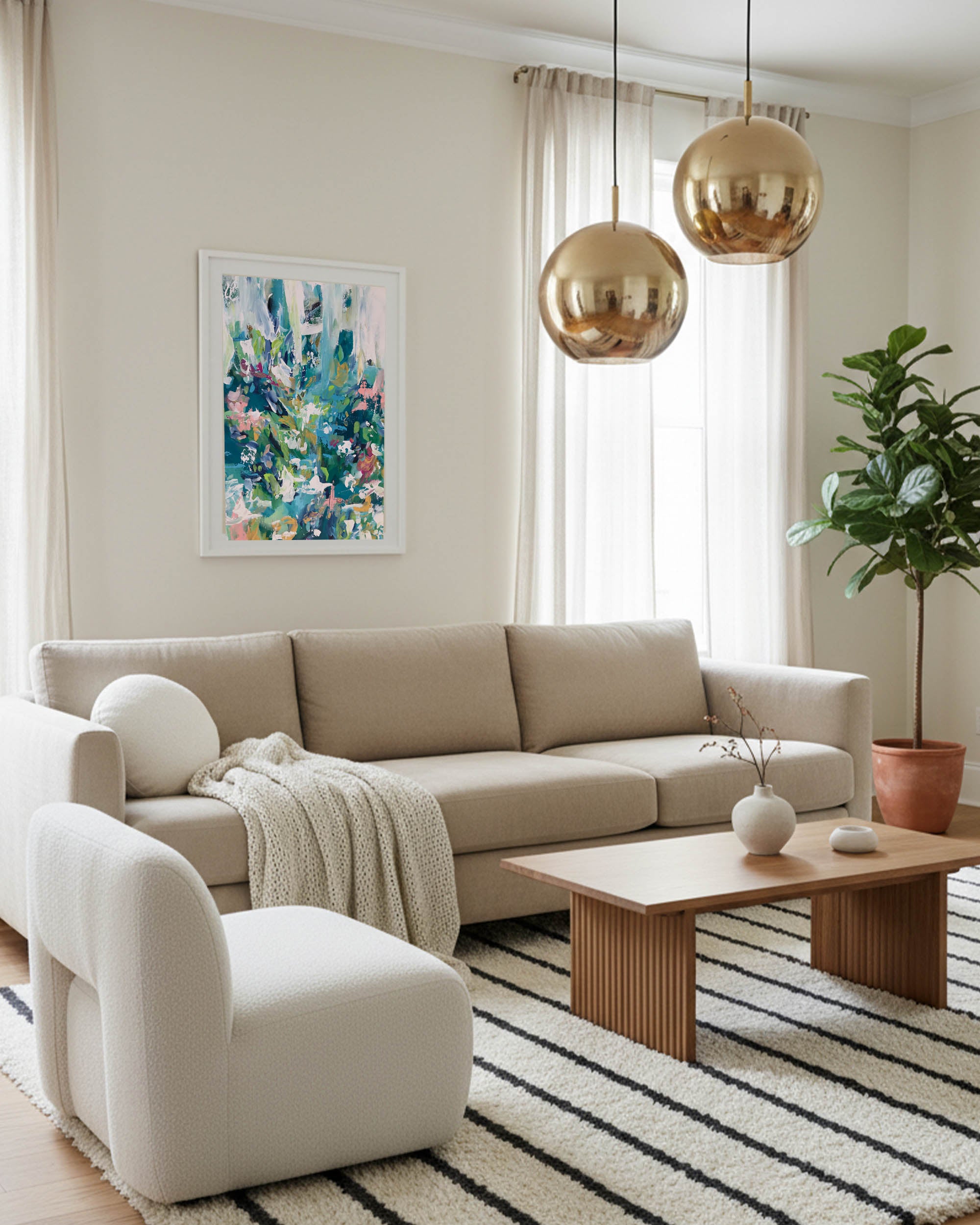 large wall art framed with modern colourful palette, brass bubble light and 3 seater beige fabric sofa and large olive tree.