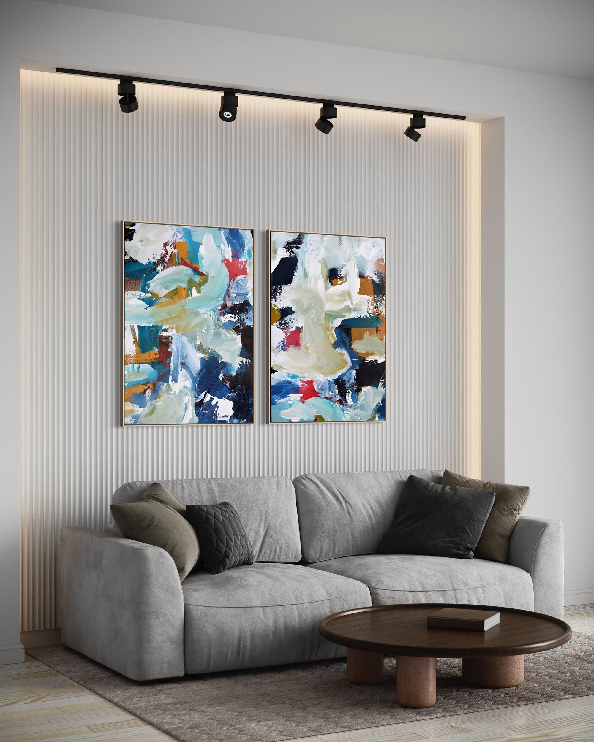 Modern living room with a gray sofa, round wooden coffee table, and abstract wall art.