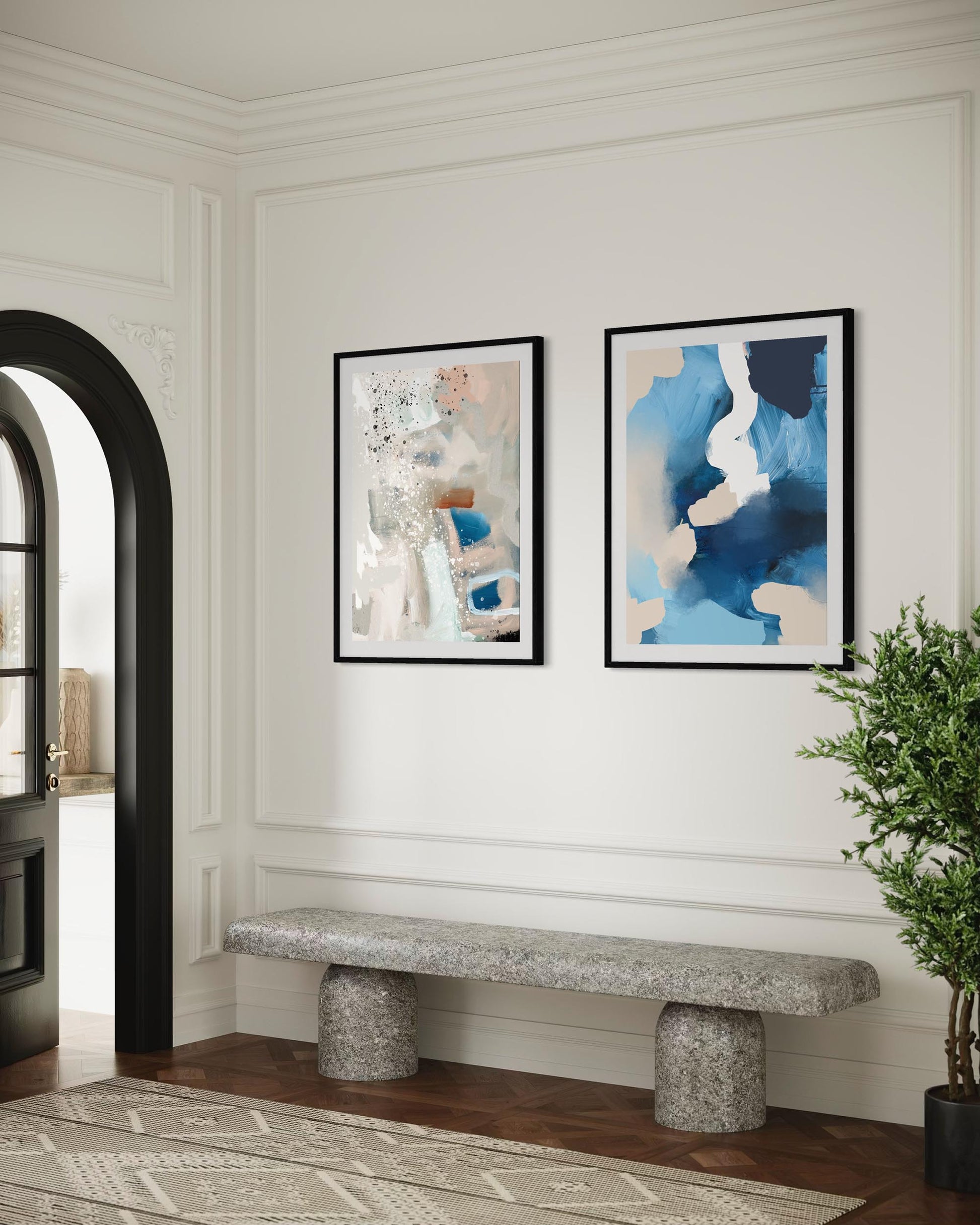 Foyer with abstract art on the wall, a stone bench, and a plant.