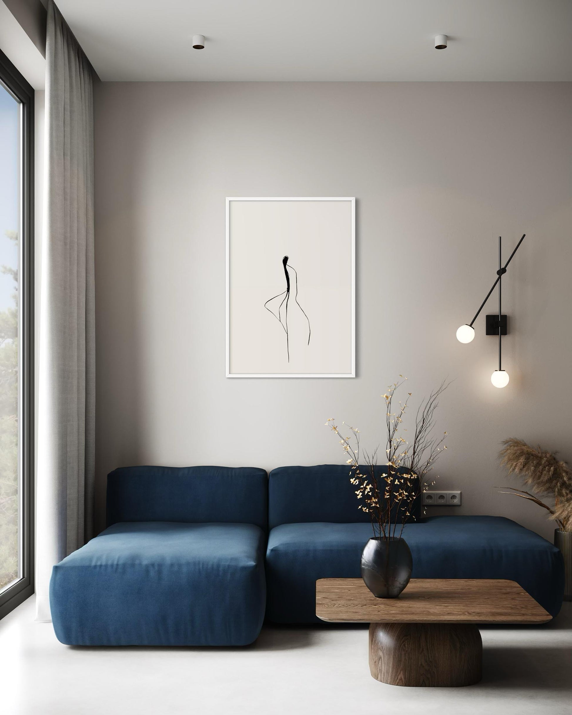 Modern living room with a blue sofa, wooden coffee table, and minimal decor.