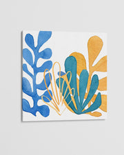 Abstract art print with blue and orange leaf shapes on a white background