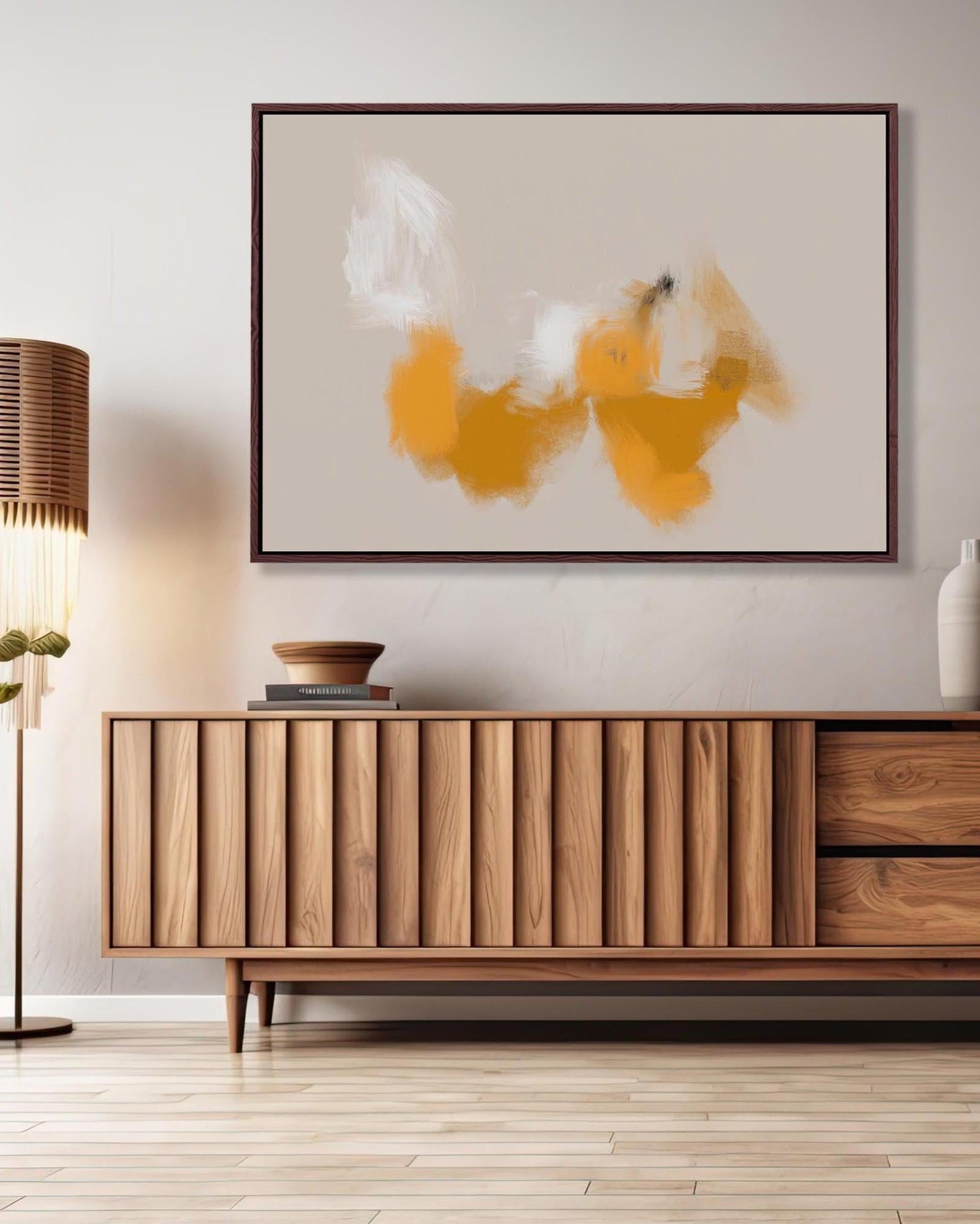 Wooden sideboard in a room with abstract art on the wall