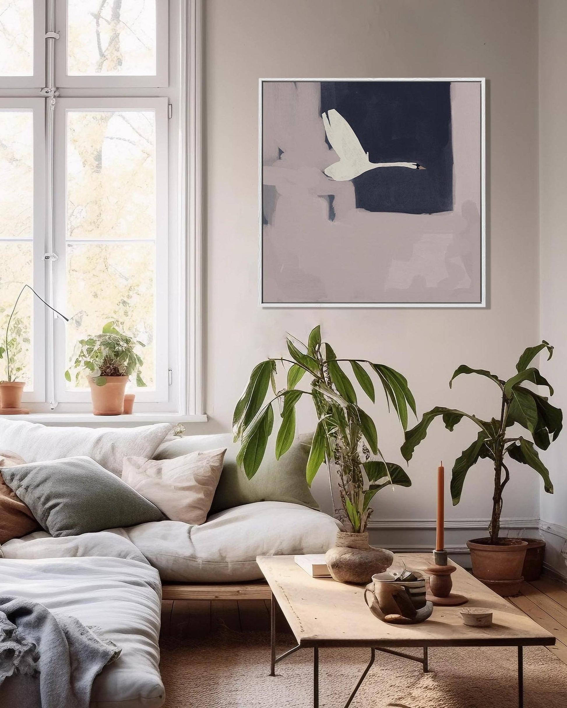 Living room with a sofa, coffee table, and wall art