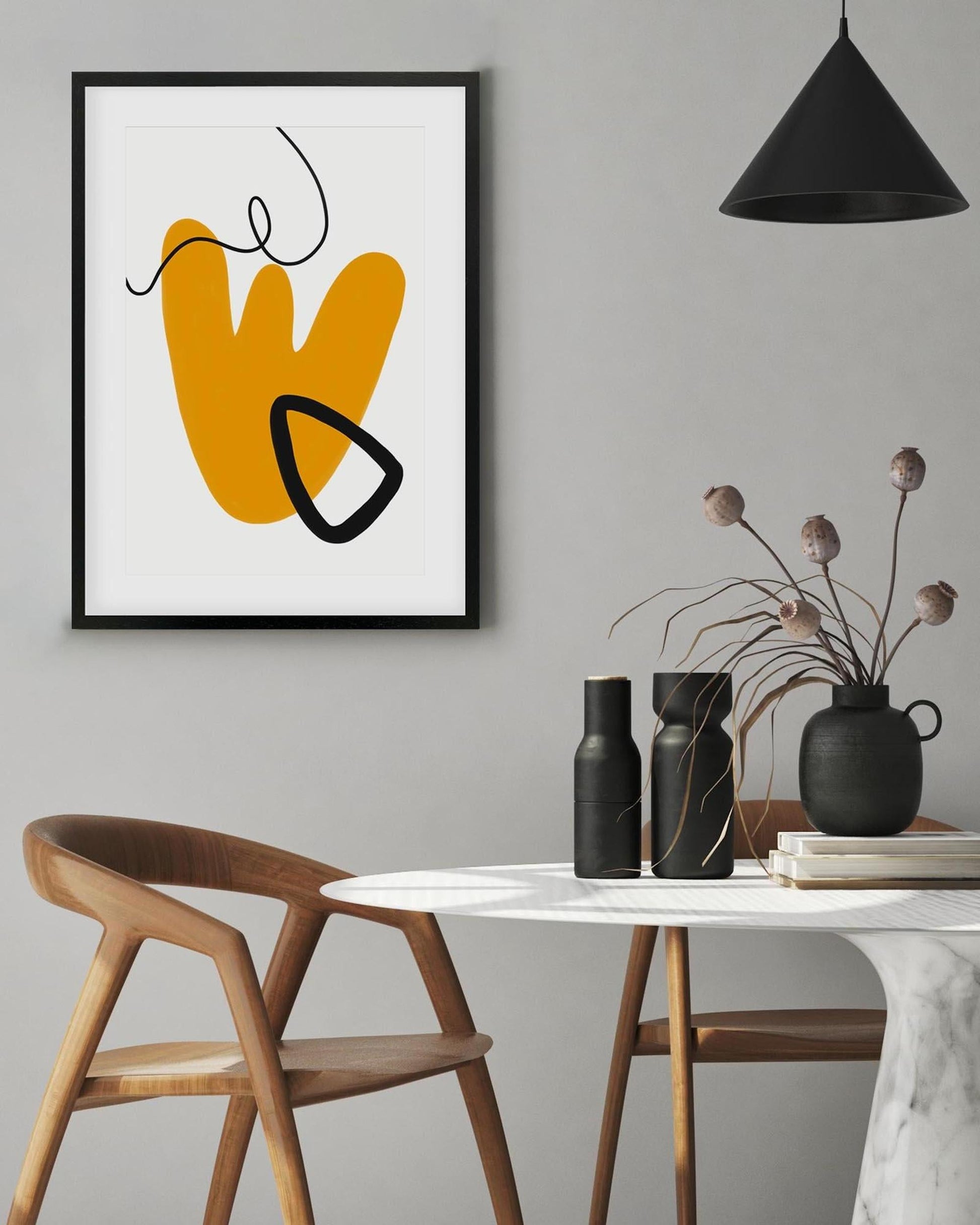 Modern interior with abstract art, table, chairs, and decorative items.