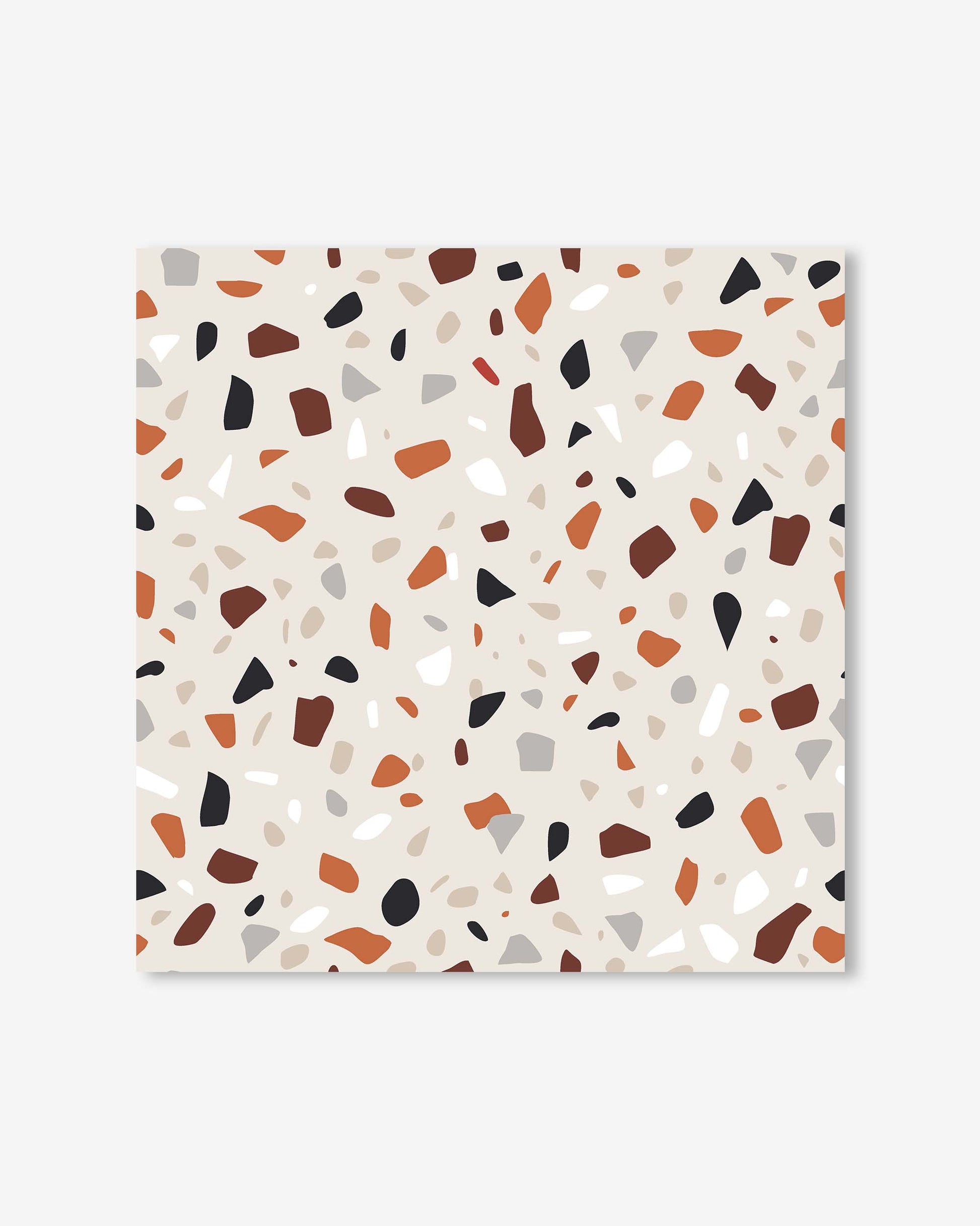 Terrazzo patterned paper with multicolored chips on a white background