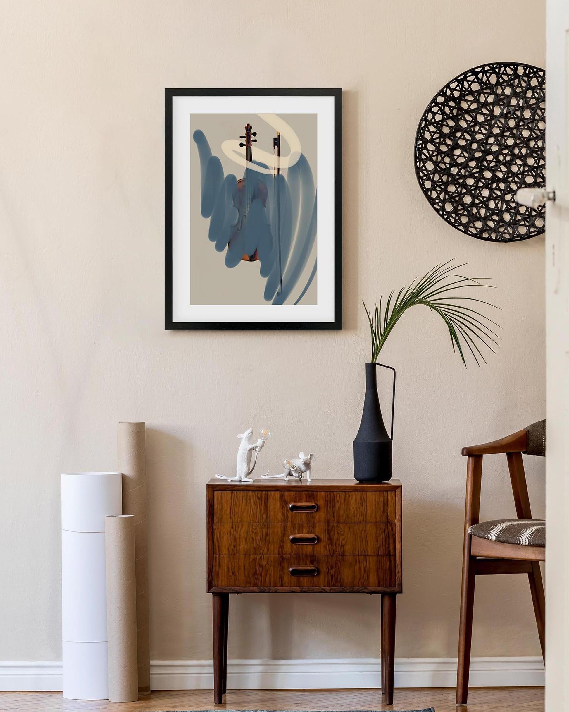 Modern interior with abstract art, wooden cabinet, and decorative items.